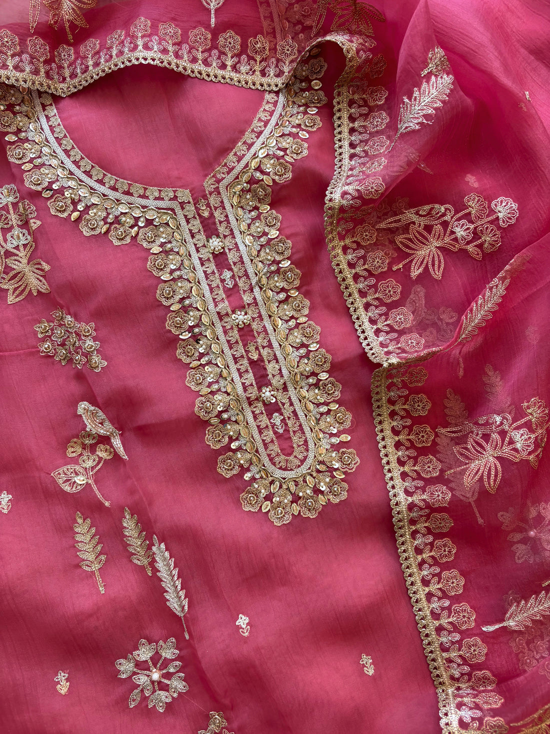 pink organza unstitched suit with zari work and bird(parrot) figure