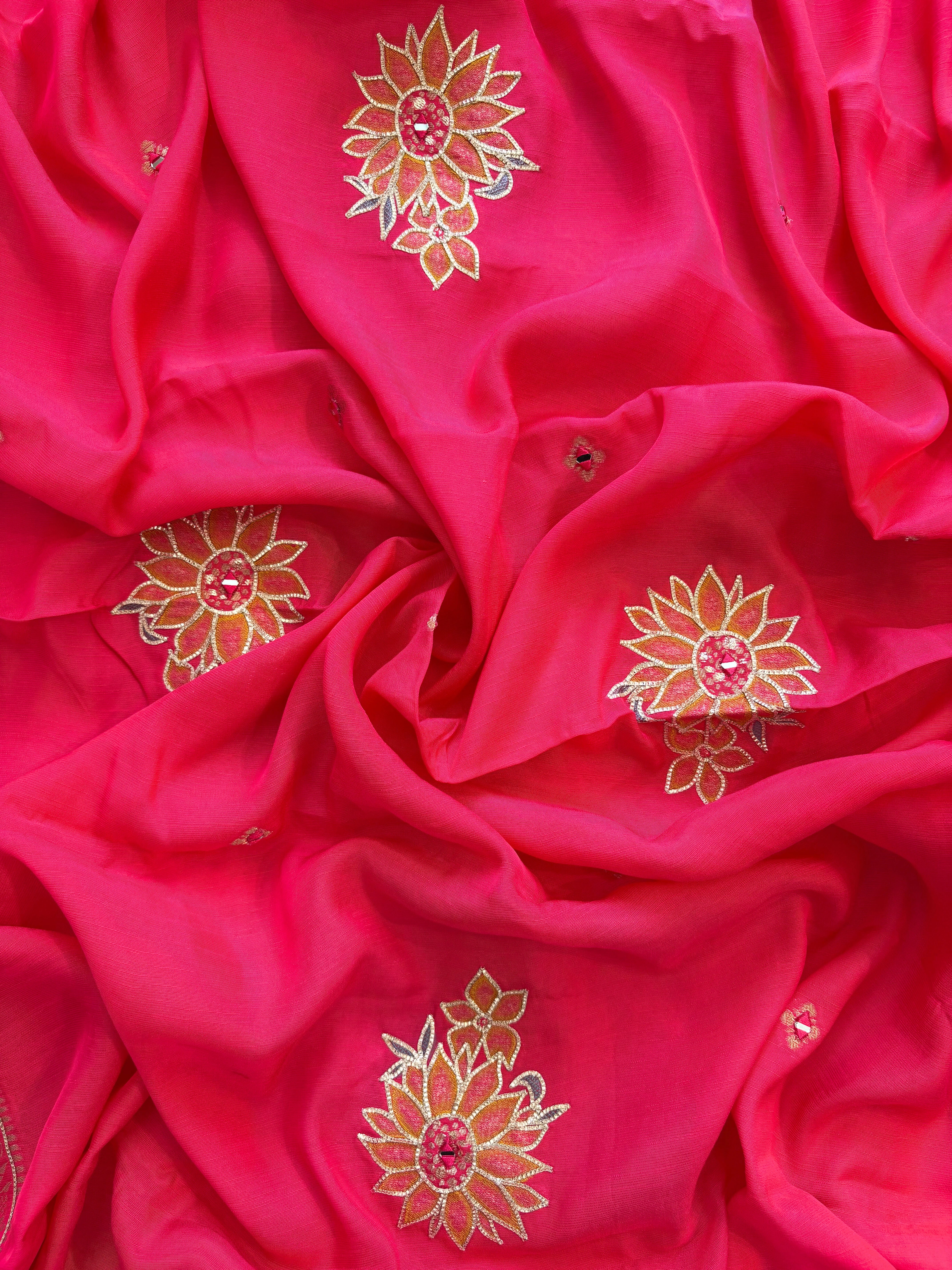 Pink linen suit with mirror work embroidery and applique floral dupatta.