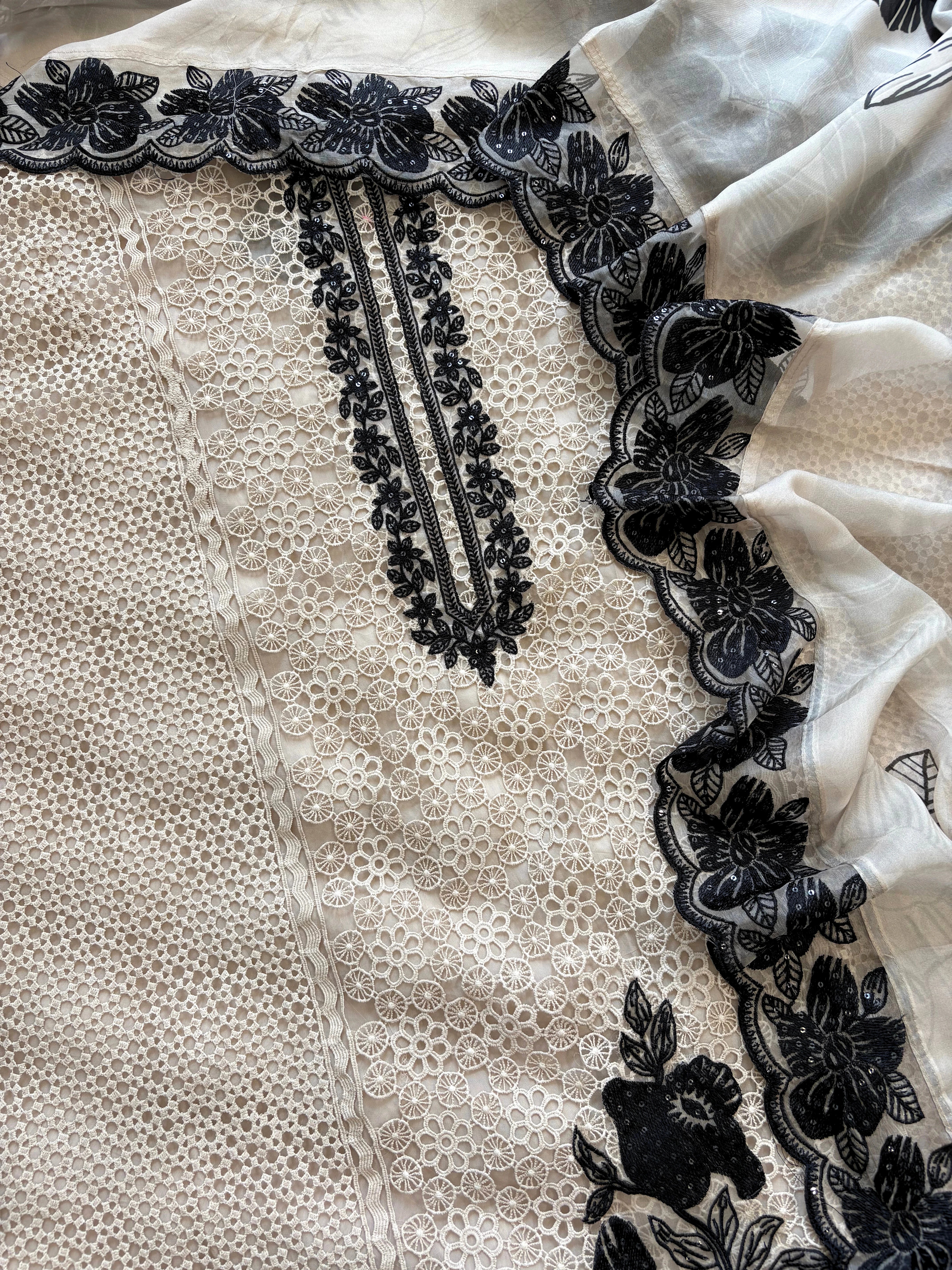 Ivory unstitched cutwork shirt with black applique embroidery and lace detailing, festive ethnic wear fabric