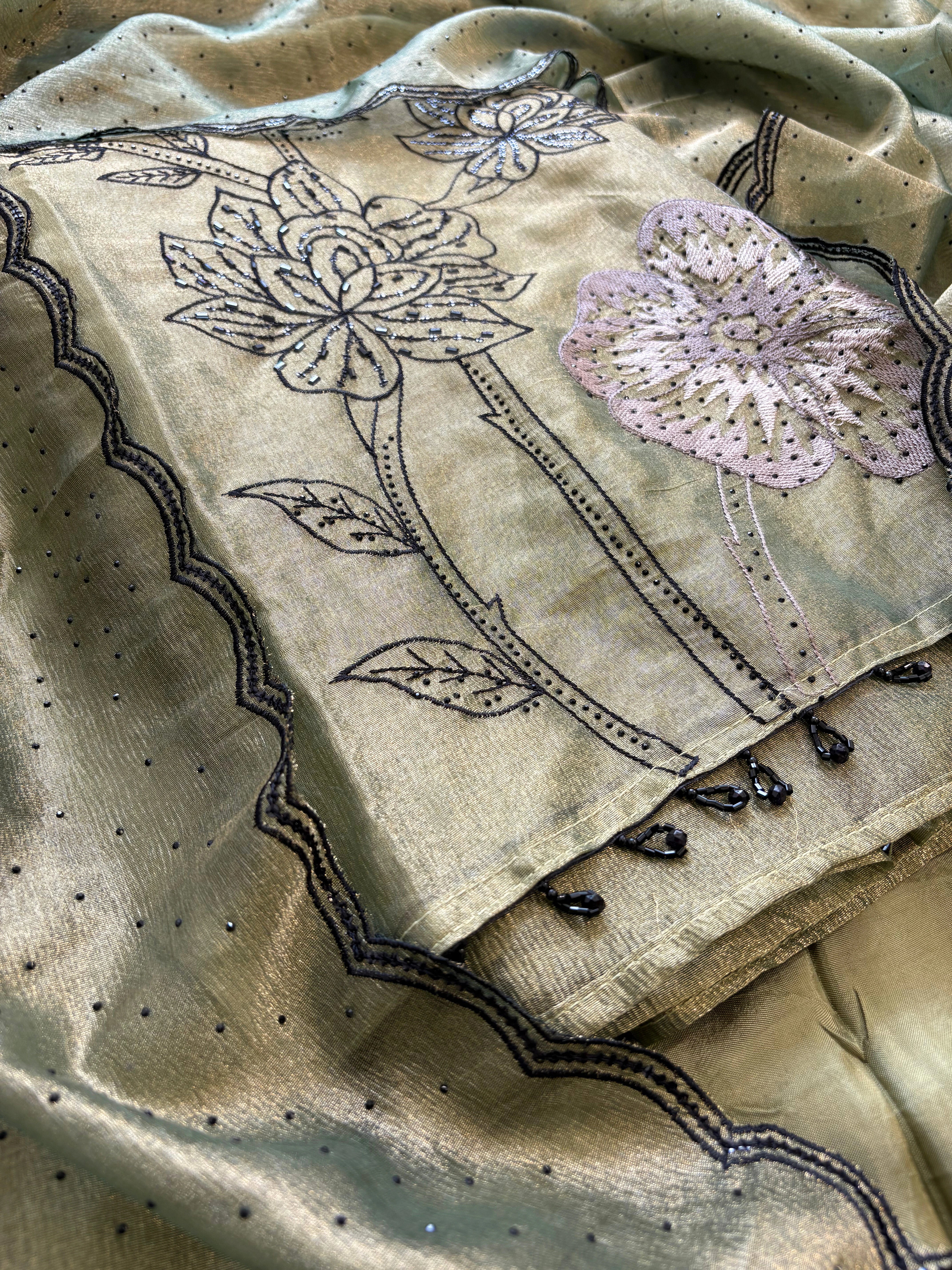 Olive green glass tissue suit with intricate embroidery and organza dupatta – luxury ethnic wear for weddings and festive occasions.