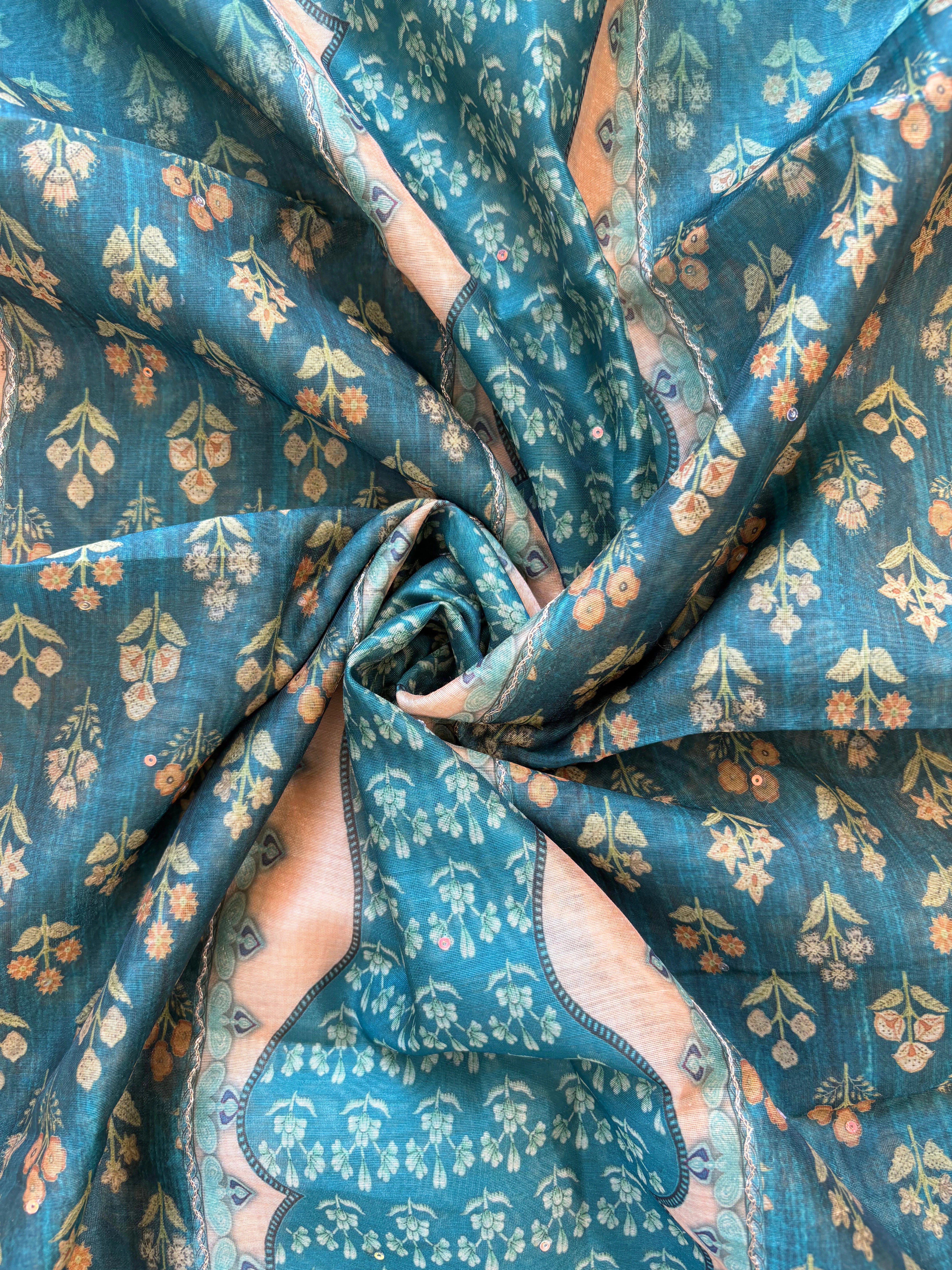 Teal green chanderi suit with golden weave and printed chanderi dupatta featuring tassel edging.