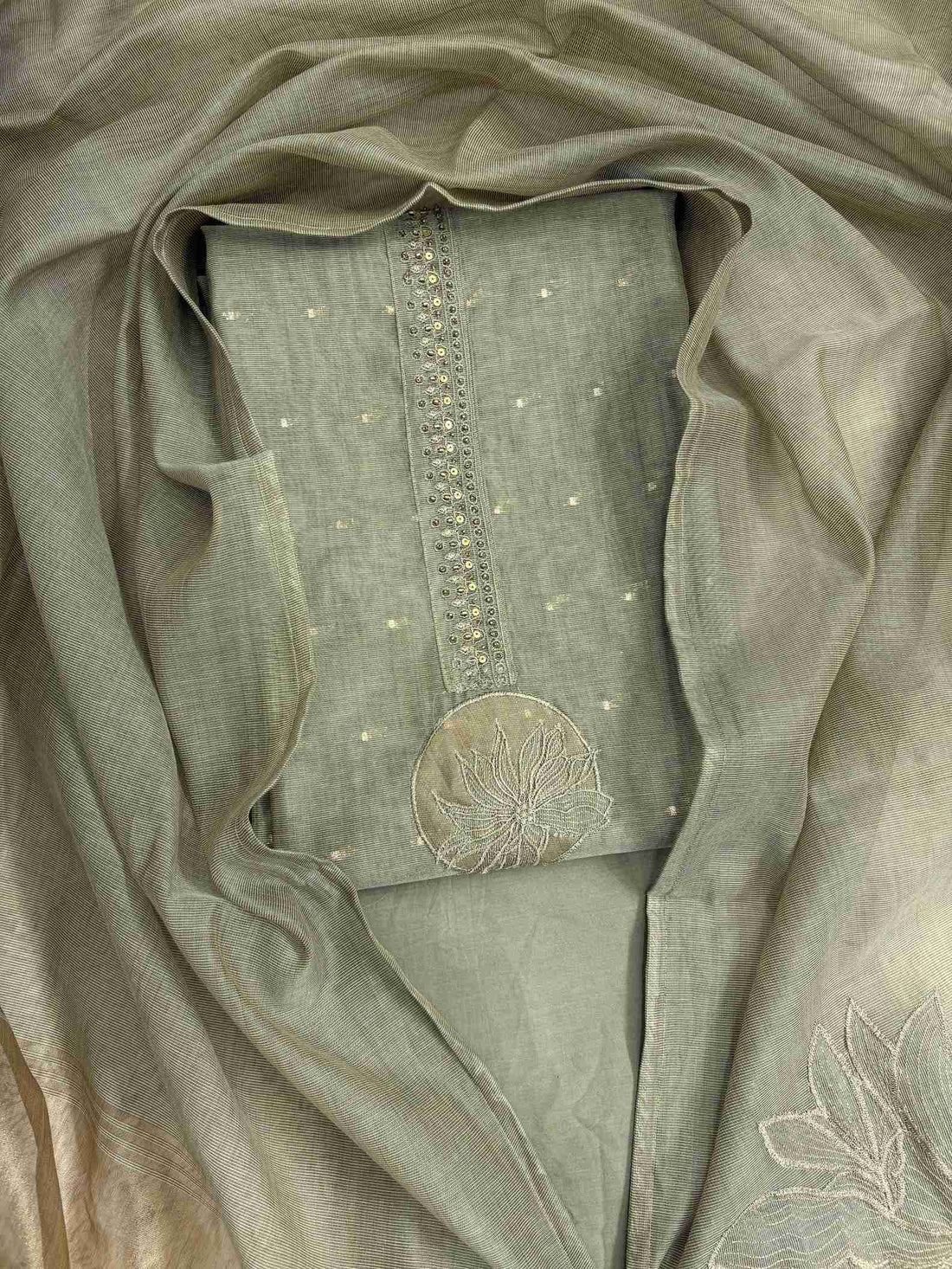 Sage Green Jamdani Cotton Unstitched Suit | Minimalist Applique Floral Neckline | Broad Gold Zari Patta Hemline & Applique Corner Dupatta Women's Suit