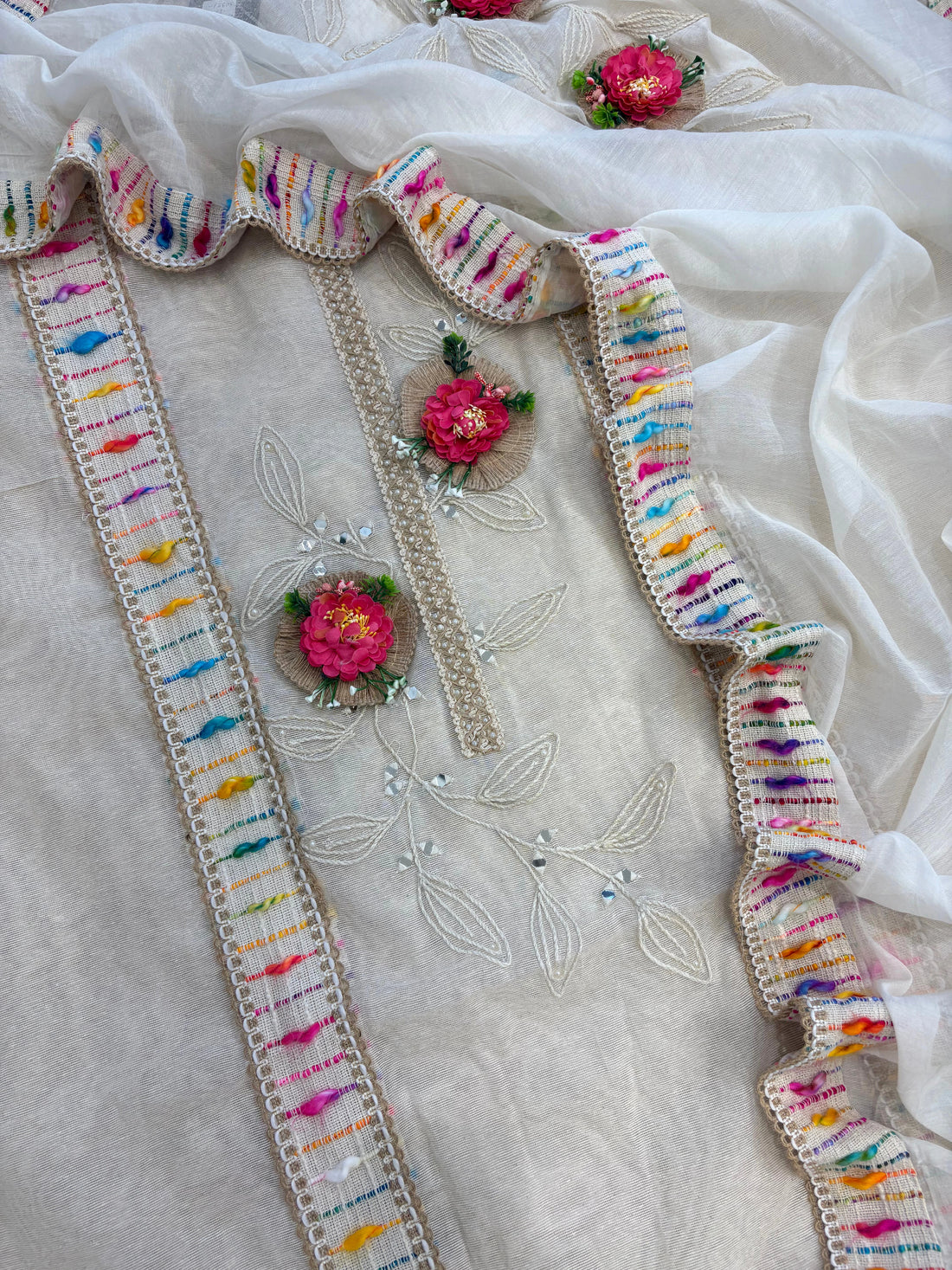 Ivory jute cotton suit with 3D floral embellishments and embroidered dupatta with multicolor thread border.