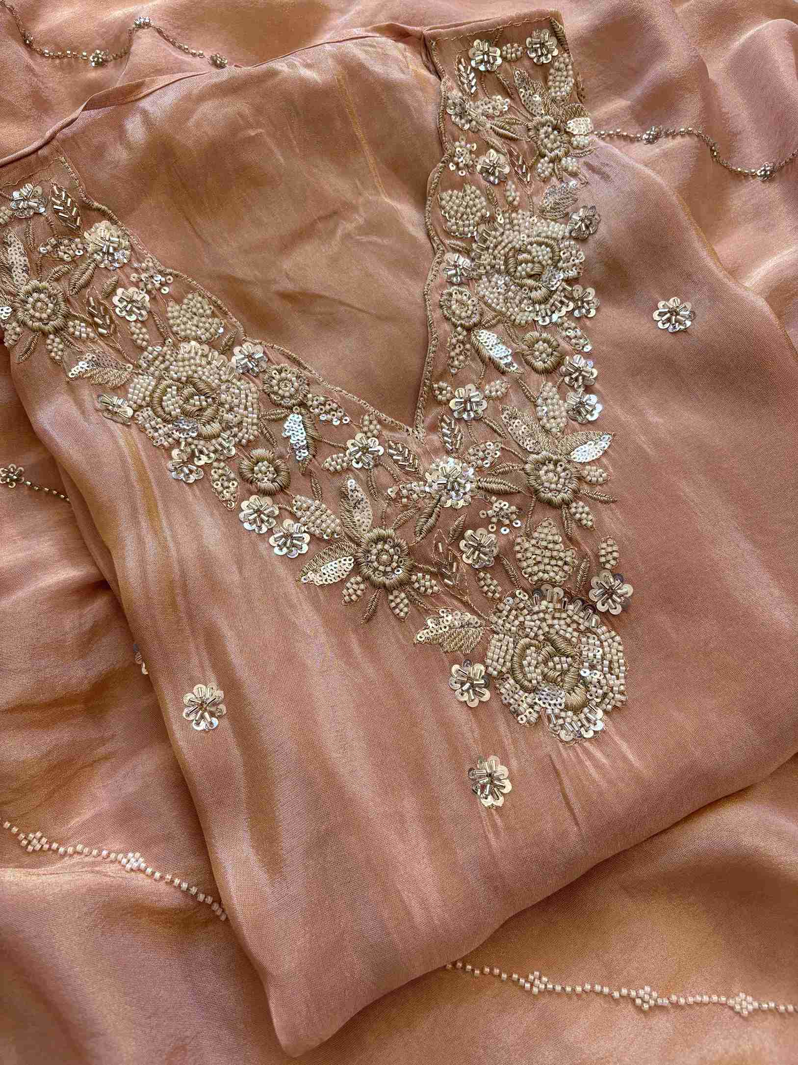 shimmer tissue party wear unstitched suit with dabka cutdana and sequence embellishments.