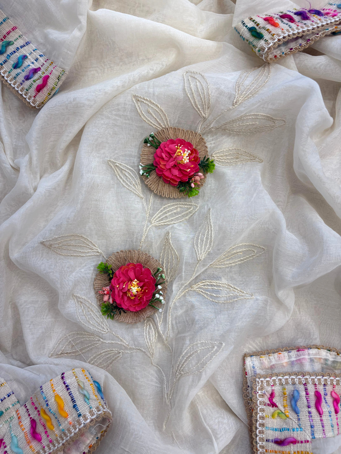 Ivory jute cotton suit with 3D floral embellishments and embroidered dupatta with multicolor thread border.