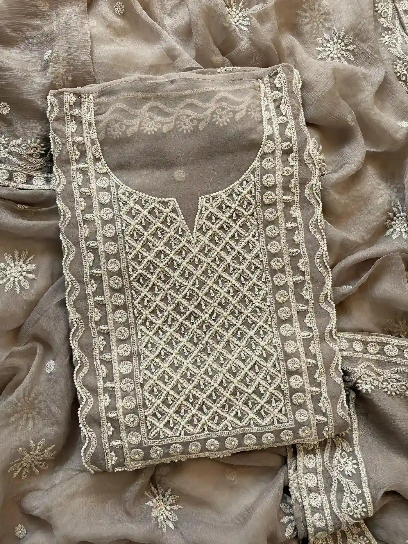 Powder brown georgette suit with moti highlighting and chiffon dupatta – embroidered festive ethnic wear for weddings and formal occasions.