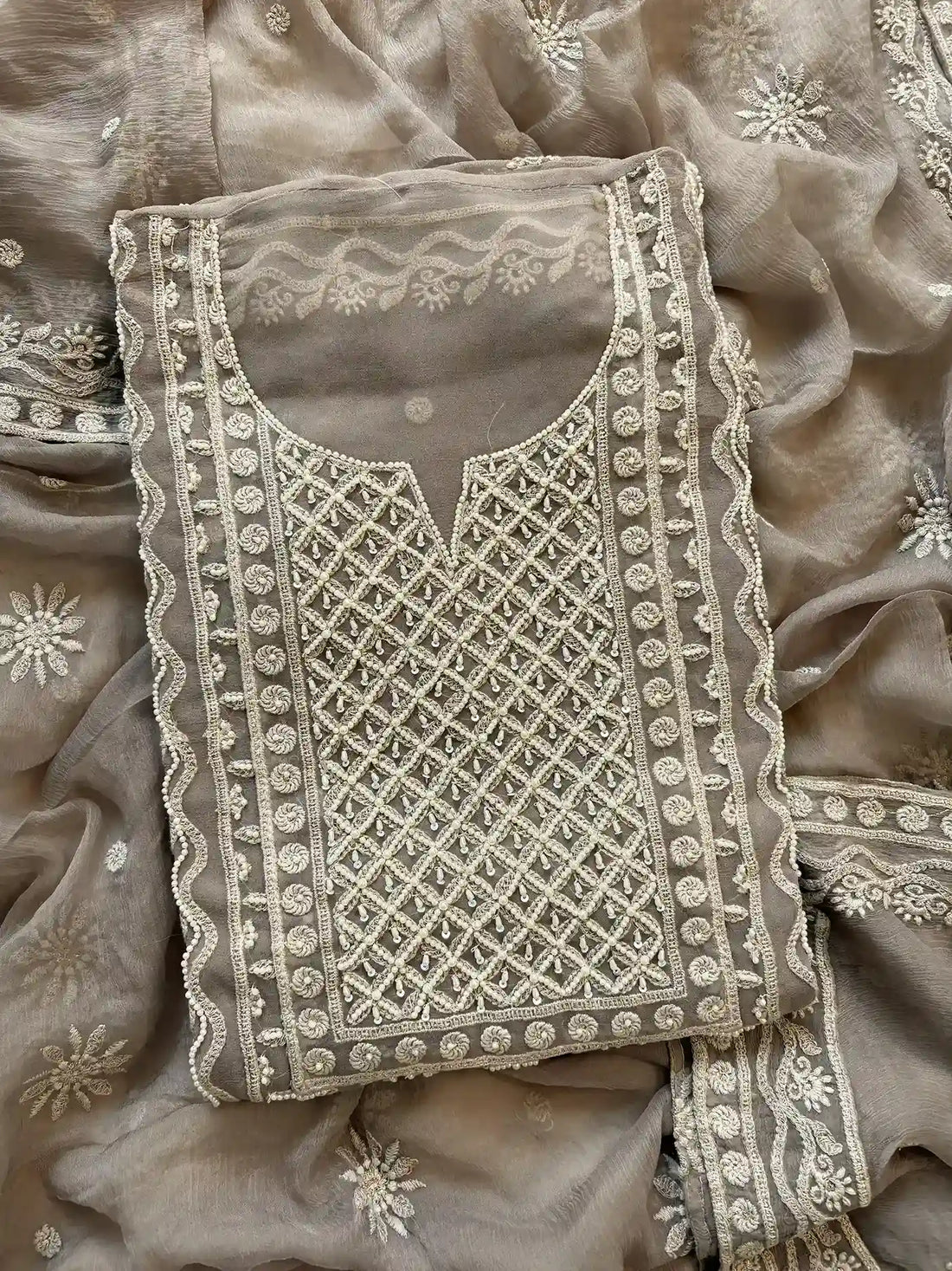 Powder brown georgette suit with moti highlighting and chiffon dupatta – embroidered festive ethnic wear for weddings and formal occasions.