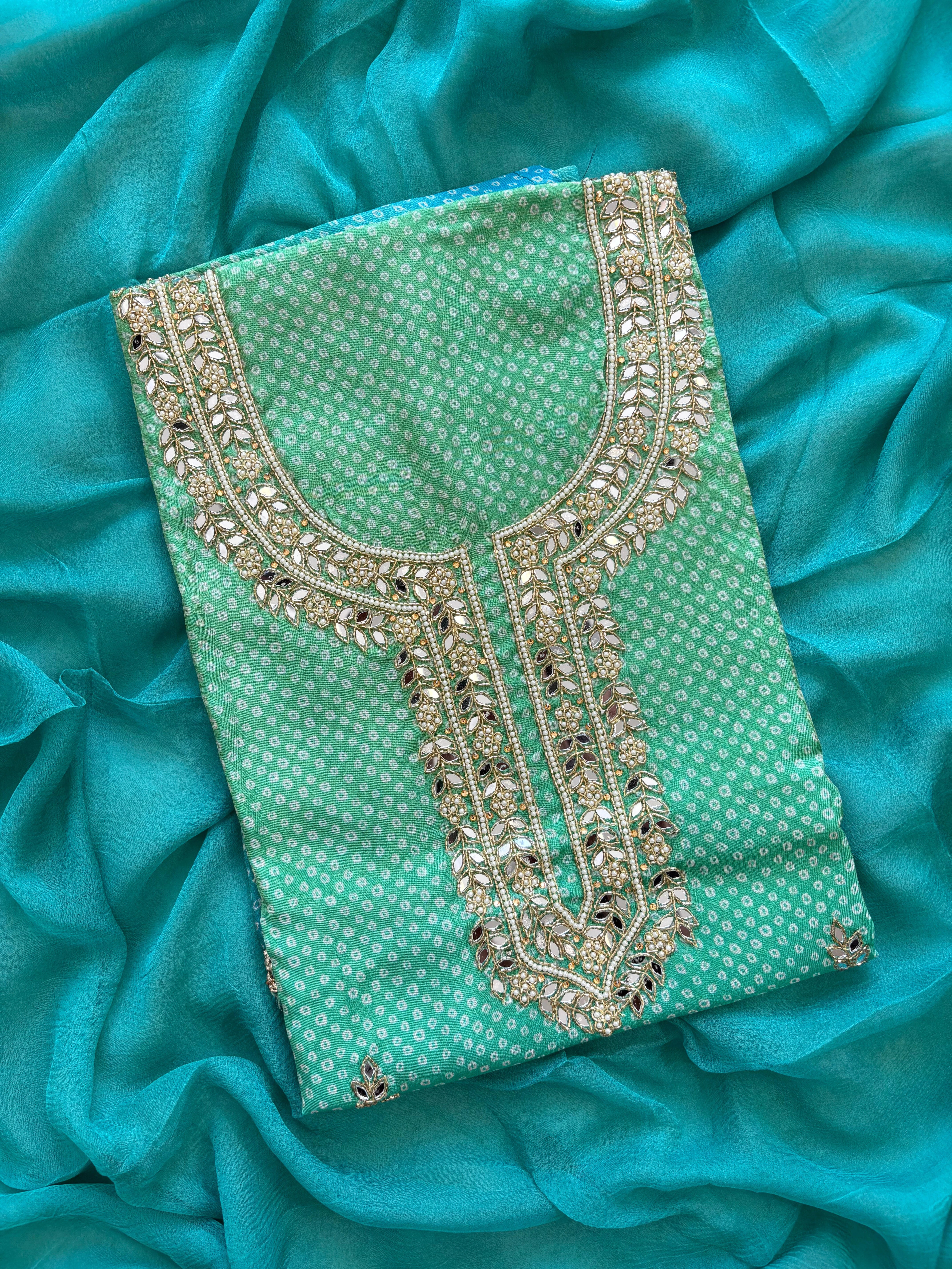 Blue Shimmer organza bandhani suit with ombre effect and chiffon dupatta with lace border.