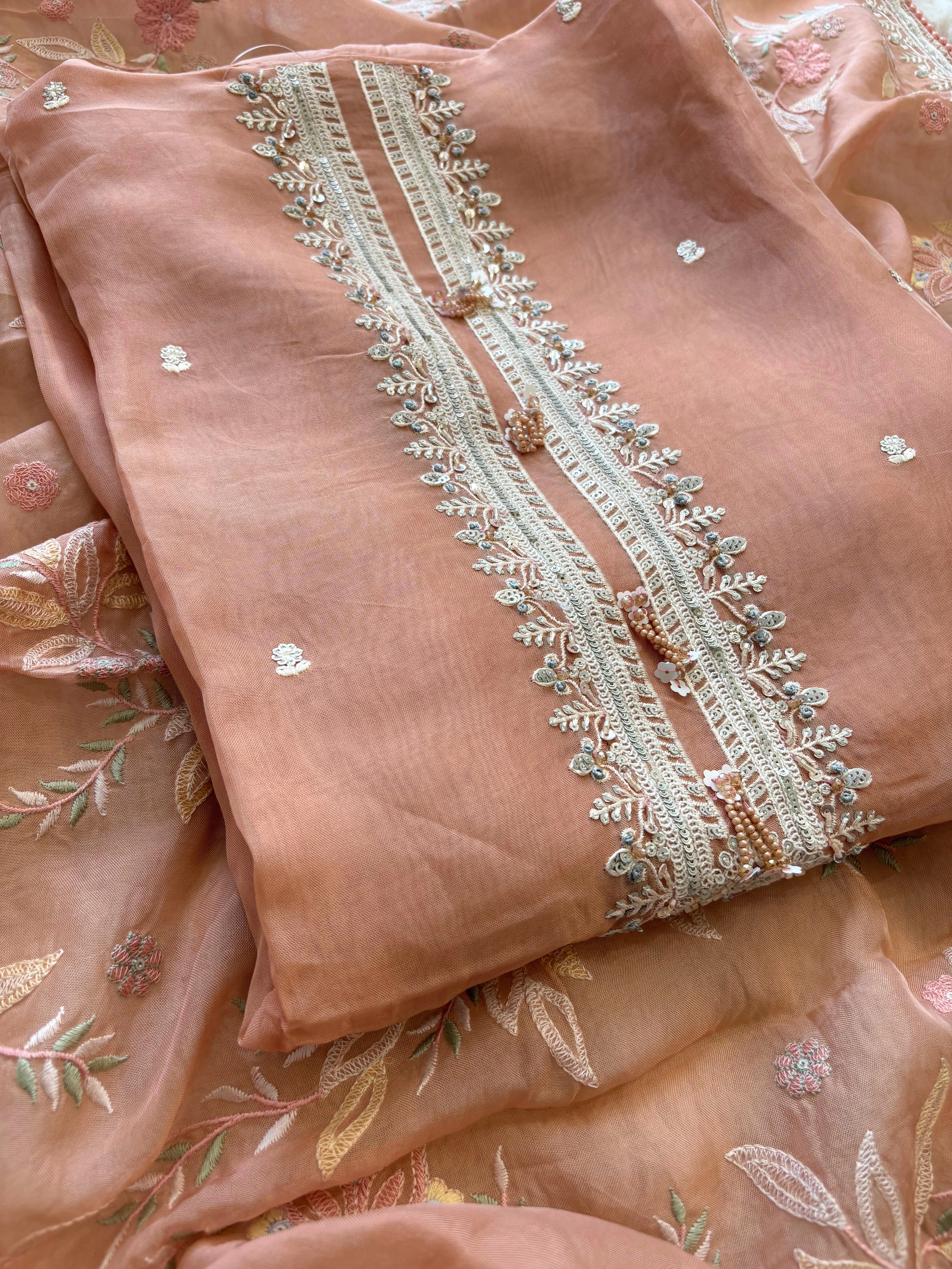 Peach color sheer organza with parsi embroidory.