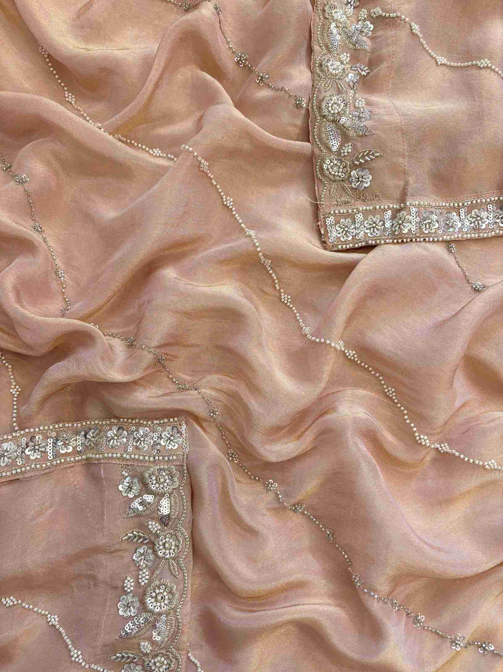 shimmer tissue party wear unstitched suit with dabka cutdana and sequence embellishments.