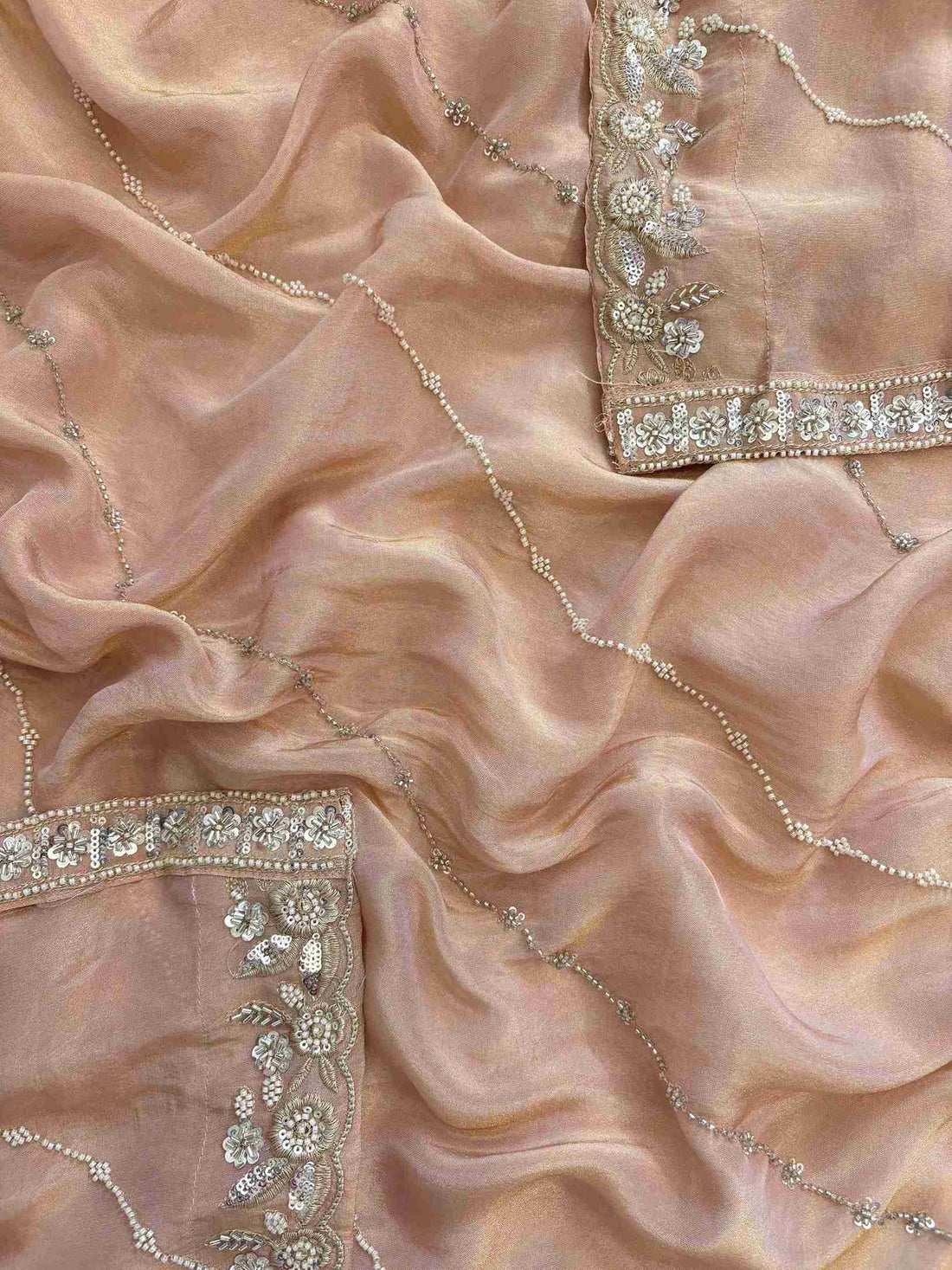 shimmer tissue party wear unstitched suit with dabka cutdana and sequence embellishments.