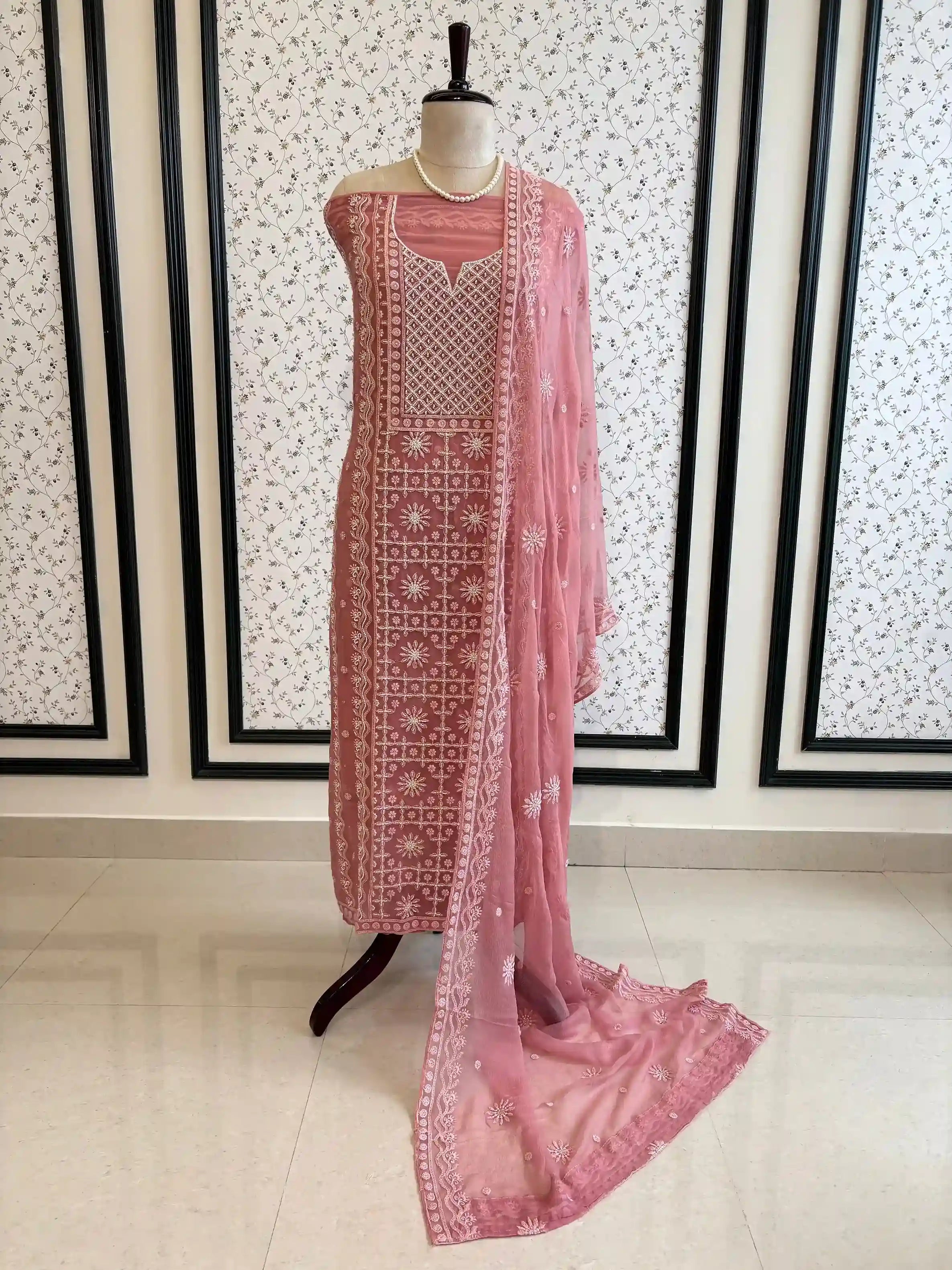 Powder pink georgette suit with moti highlighting and chiffon dupatta – embroidered festive ethnic wear for weddings and formal occasions.
