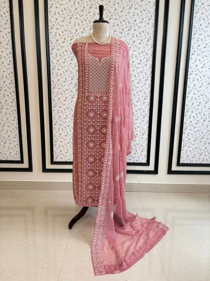 Powder pink georgette suit with moti highlighting and chiffon dupatta – embroidered festive ethnic wear for weddings and formal occasions.
