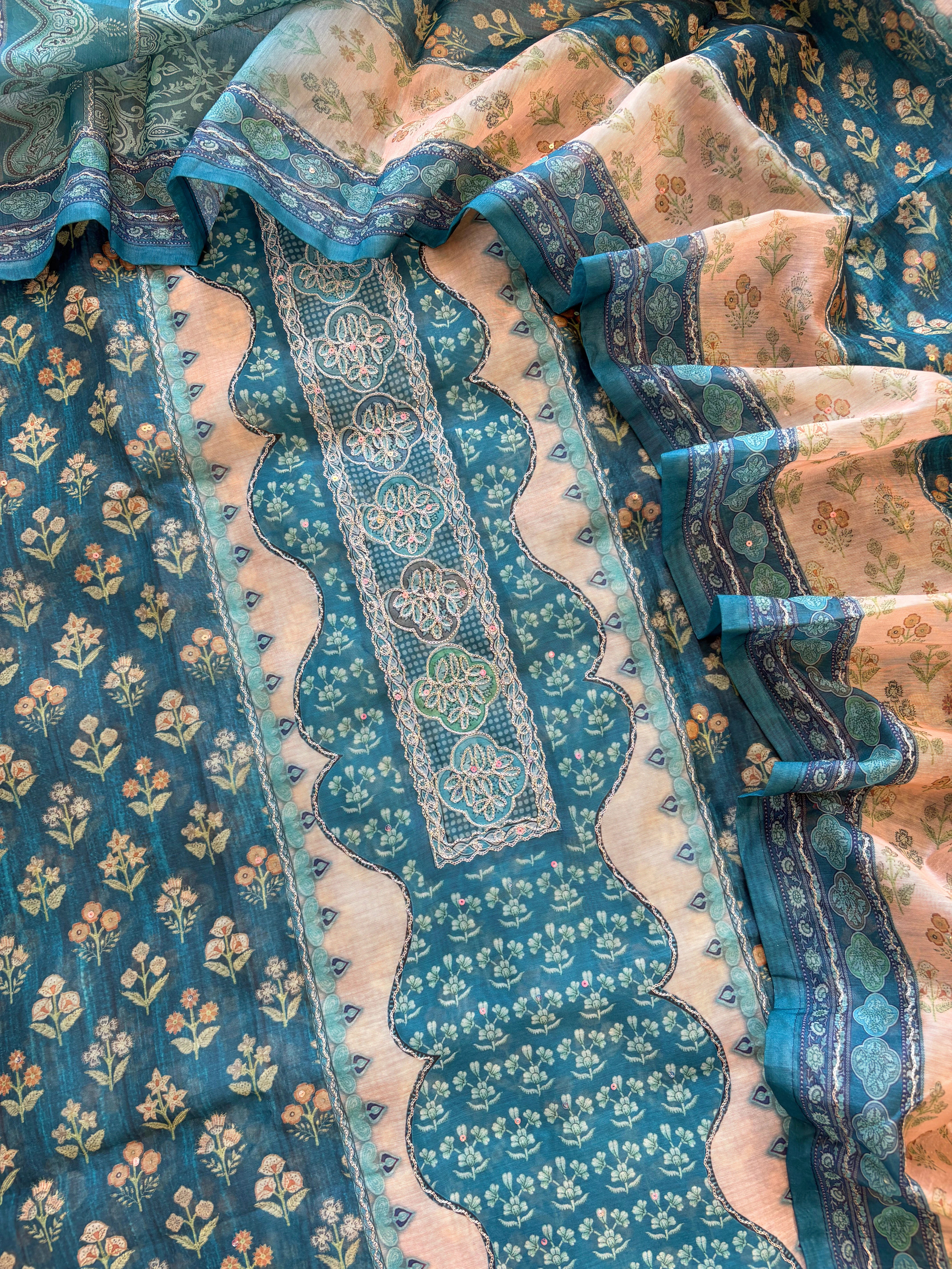 Teal green chanderi suit with golden weave and printed chanderi dupatta featuring tassel edging.