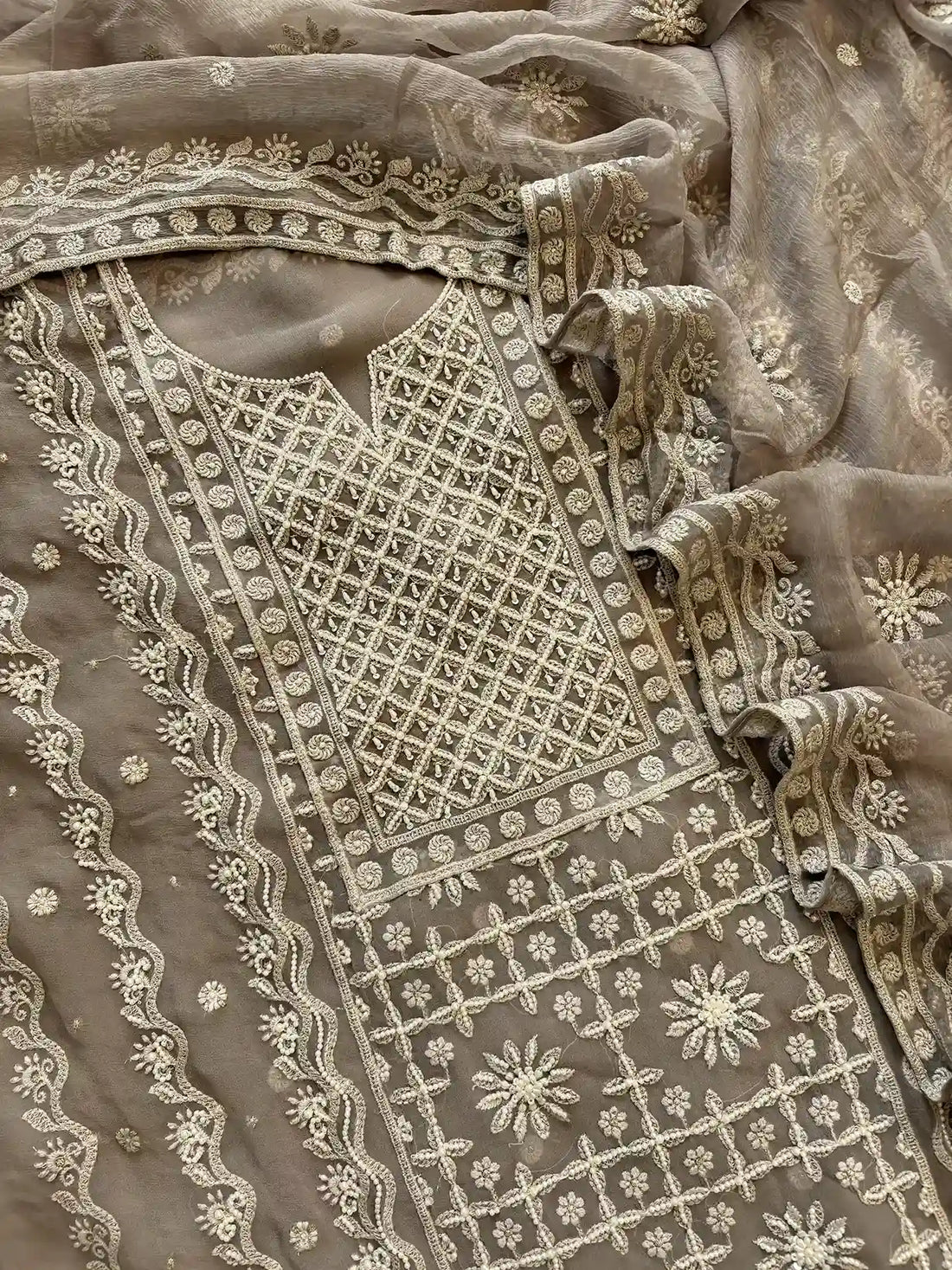 Powder brown georgette suit with moti highlighting and chiffon dupatta – embroidered festive ethnic wear for weddings and formal occasions.