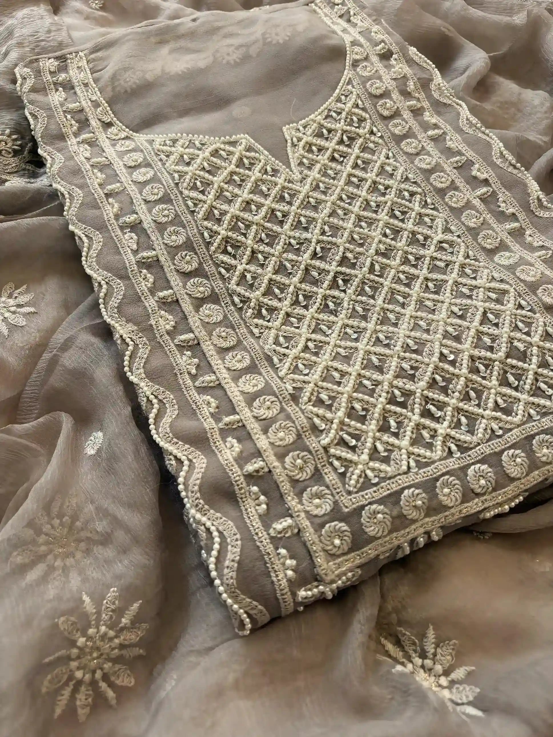 Powder brown georgette suit with moti highlighting and chiffon dupatta – embroidered festive ethnic wear for weddings and formal occasions.