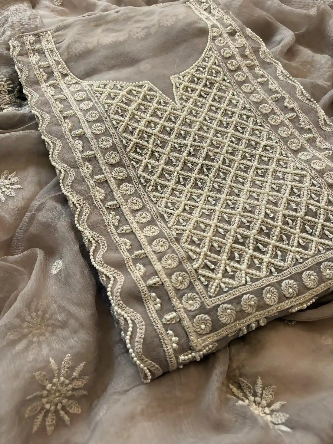 Powder brown georgette suit with moti highlighting and chiffon dupatta – embroidered festive ethnic wear for weddings and formal occasions.