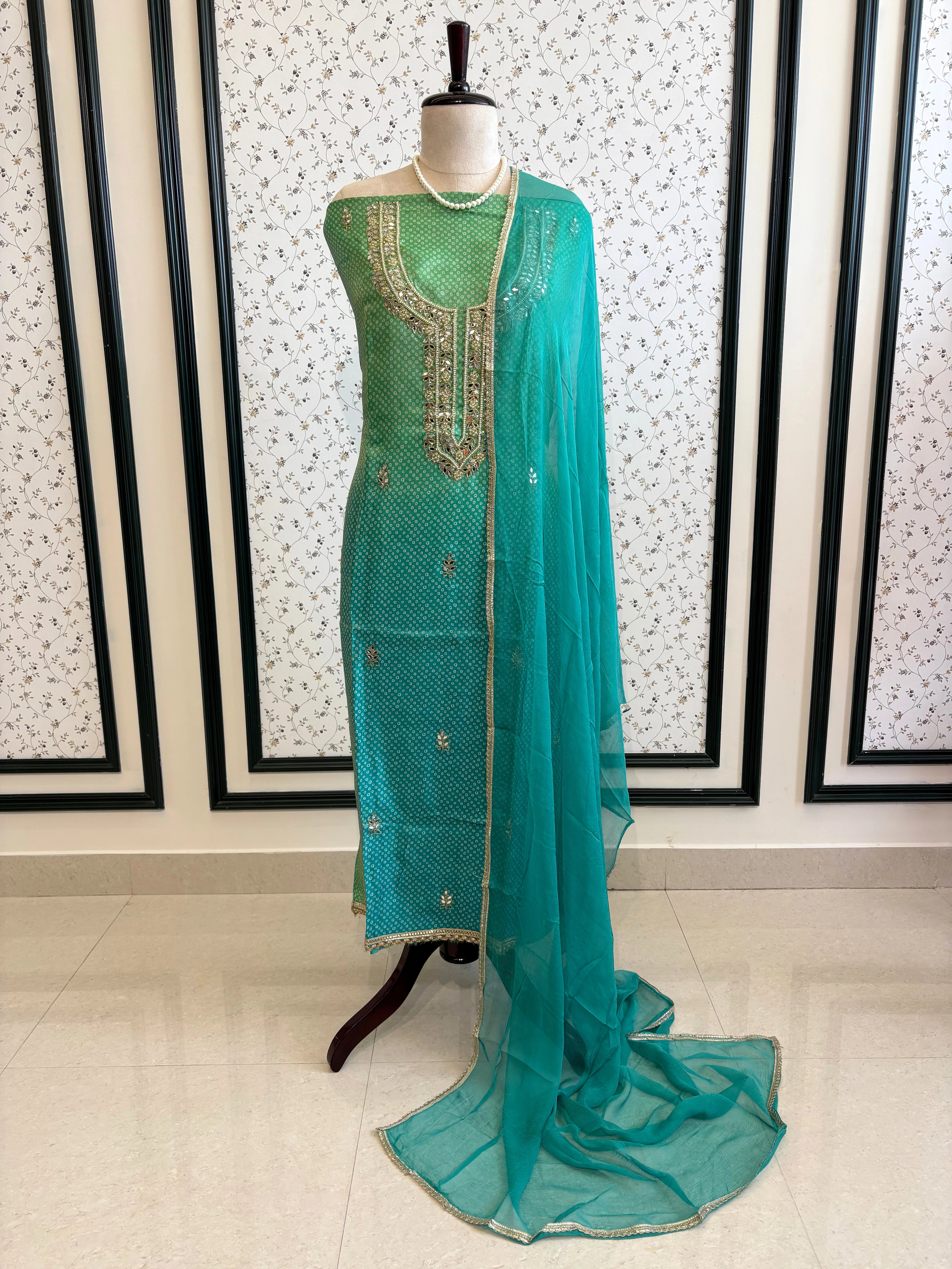 Blue Shimmer organza bandhani suit with ombre effect and chiffon dupatta with lace border.