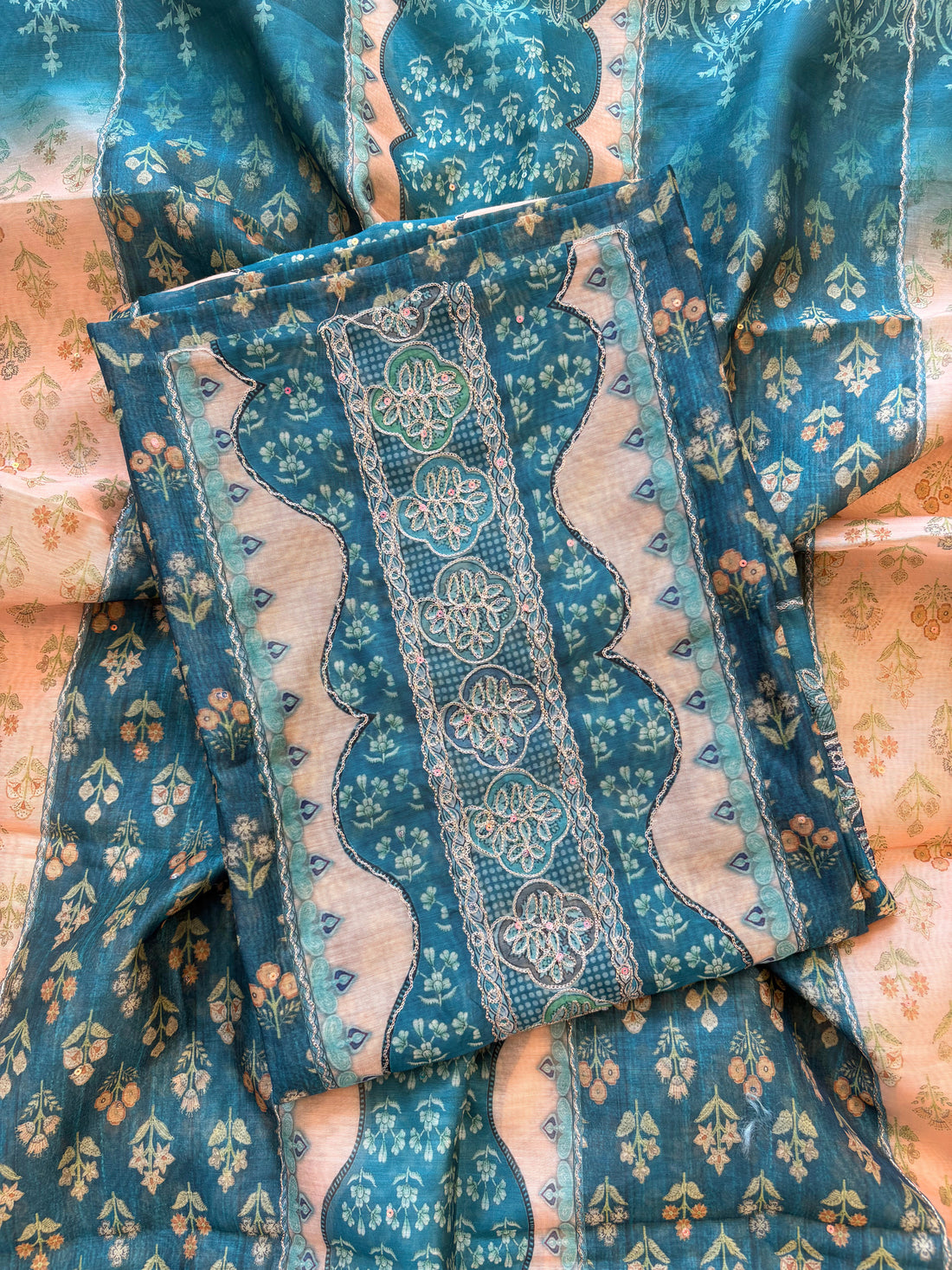 Teal green chanderi suit with golden weave and printed chanderi dupatta featuring tassel edging.