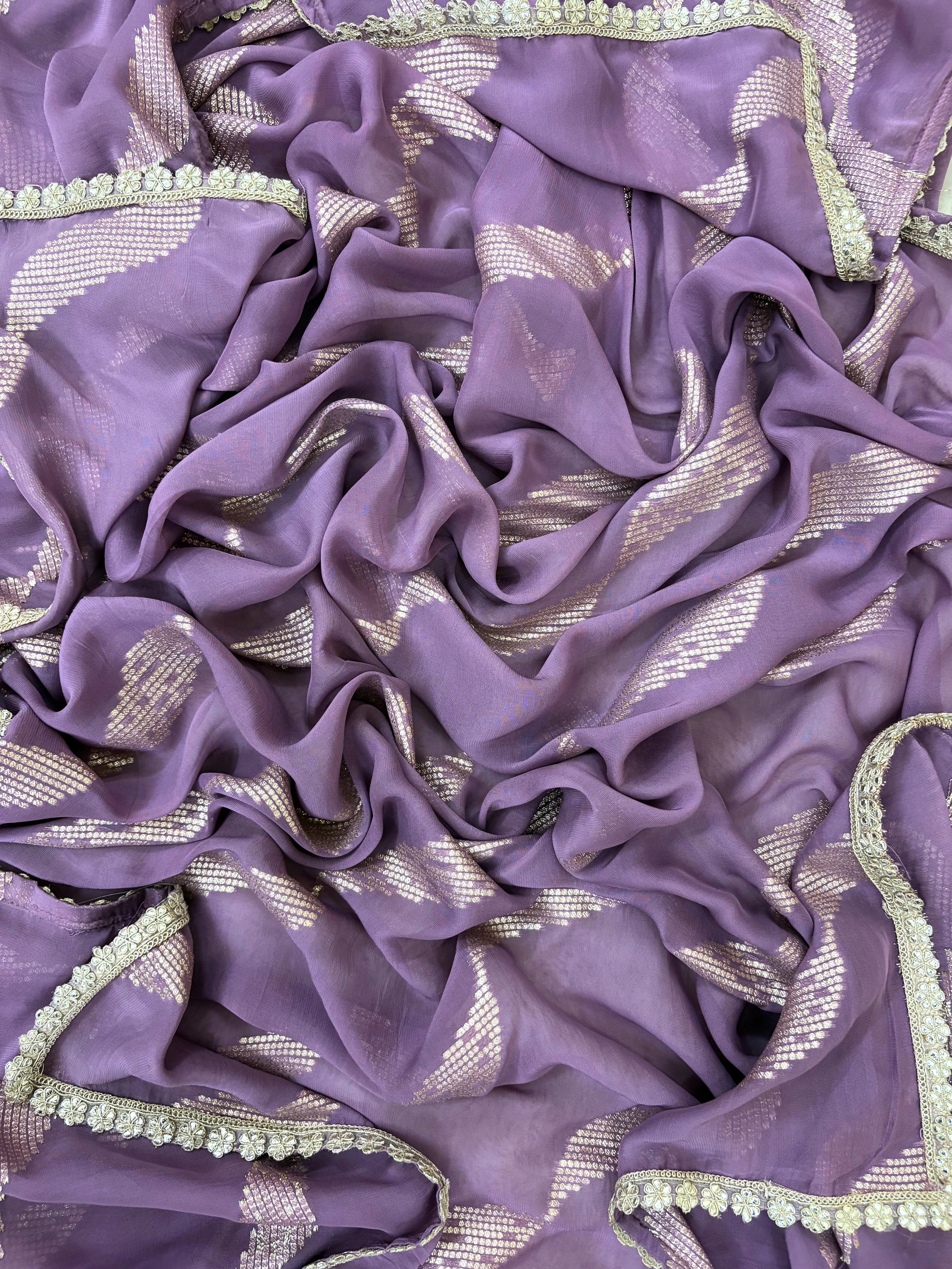 Pastel purple organza suit with gold zari embroidery, pearl embellishments, and sequin work, paired with an banarisi jacquard dupatta for weddings and festive occasions.