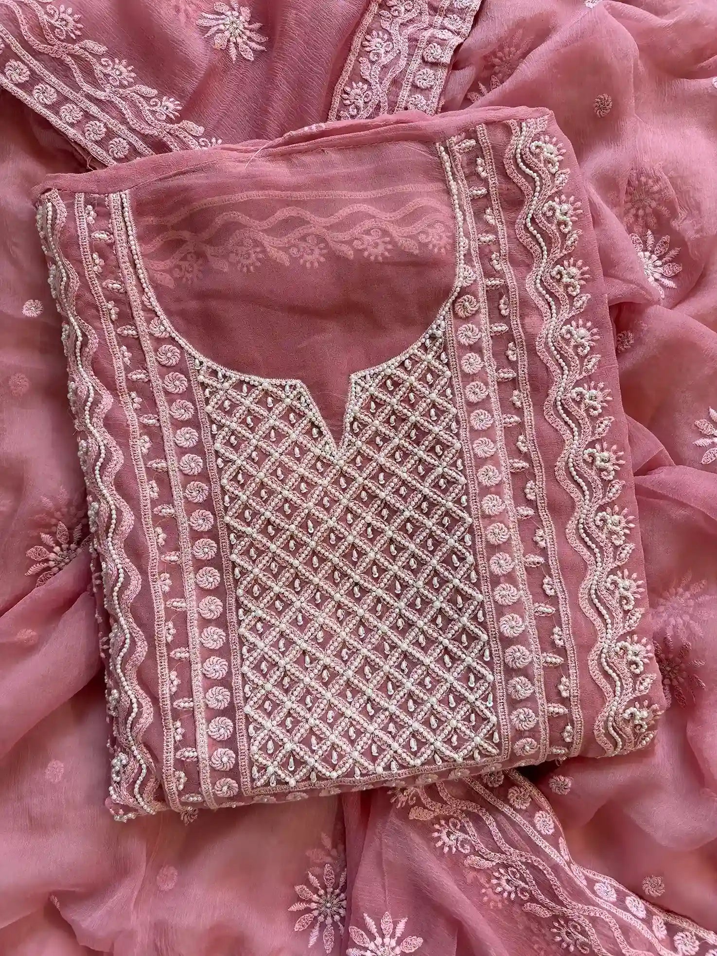 Powder pink georgette suit with moti highlighting and chiffon dupatta – embroidered festive ethnic wear for weddings and formal occasions.