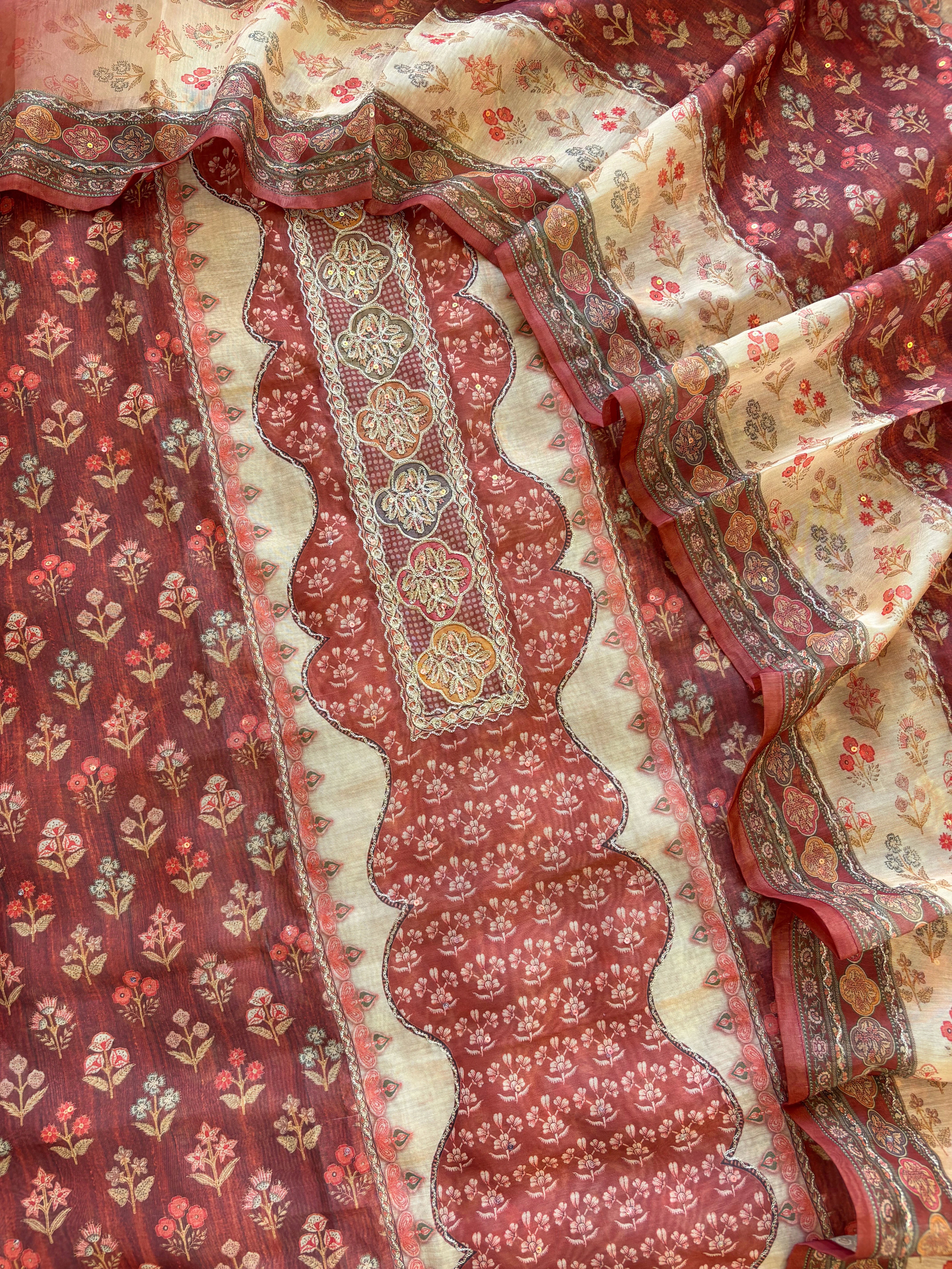 Rust red chanderi suit with golden weave and printed chanderi dupatta featuring tassel edging.