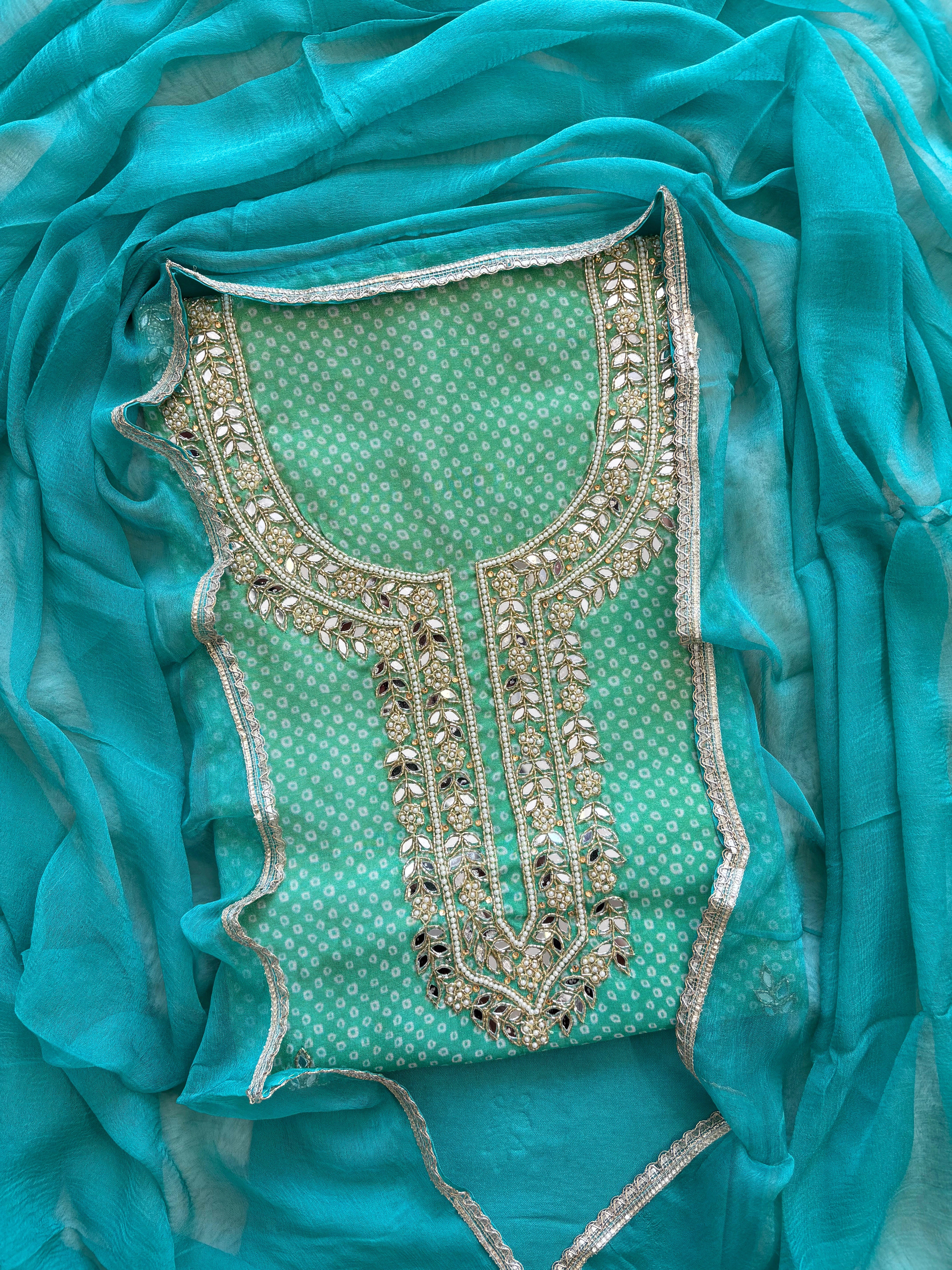 Blue Shimmer organza bandhani suit with ombre effect and chiffon dupatta with lace border.
