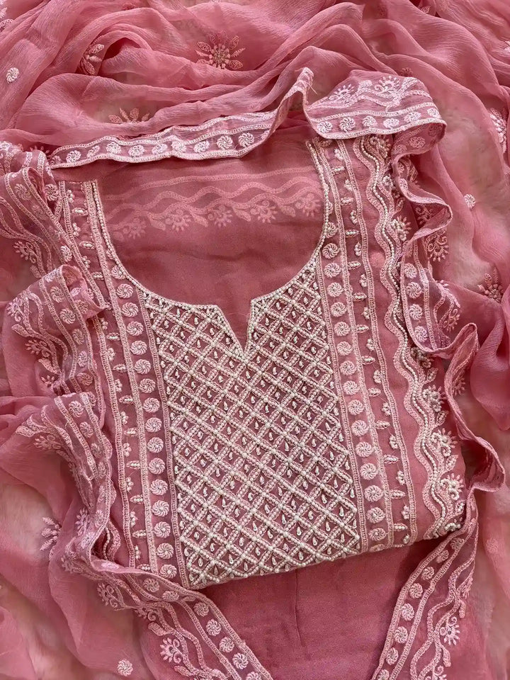 Powder pink georgette suit with moti highlighting and chiffon dupatta – embroidered festive ethnic wear for weddings and formal occasions.