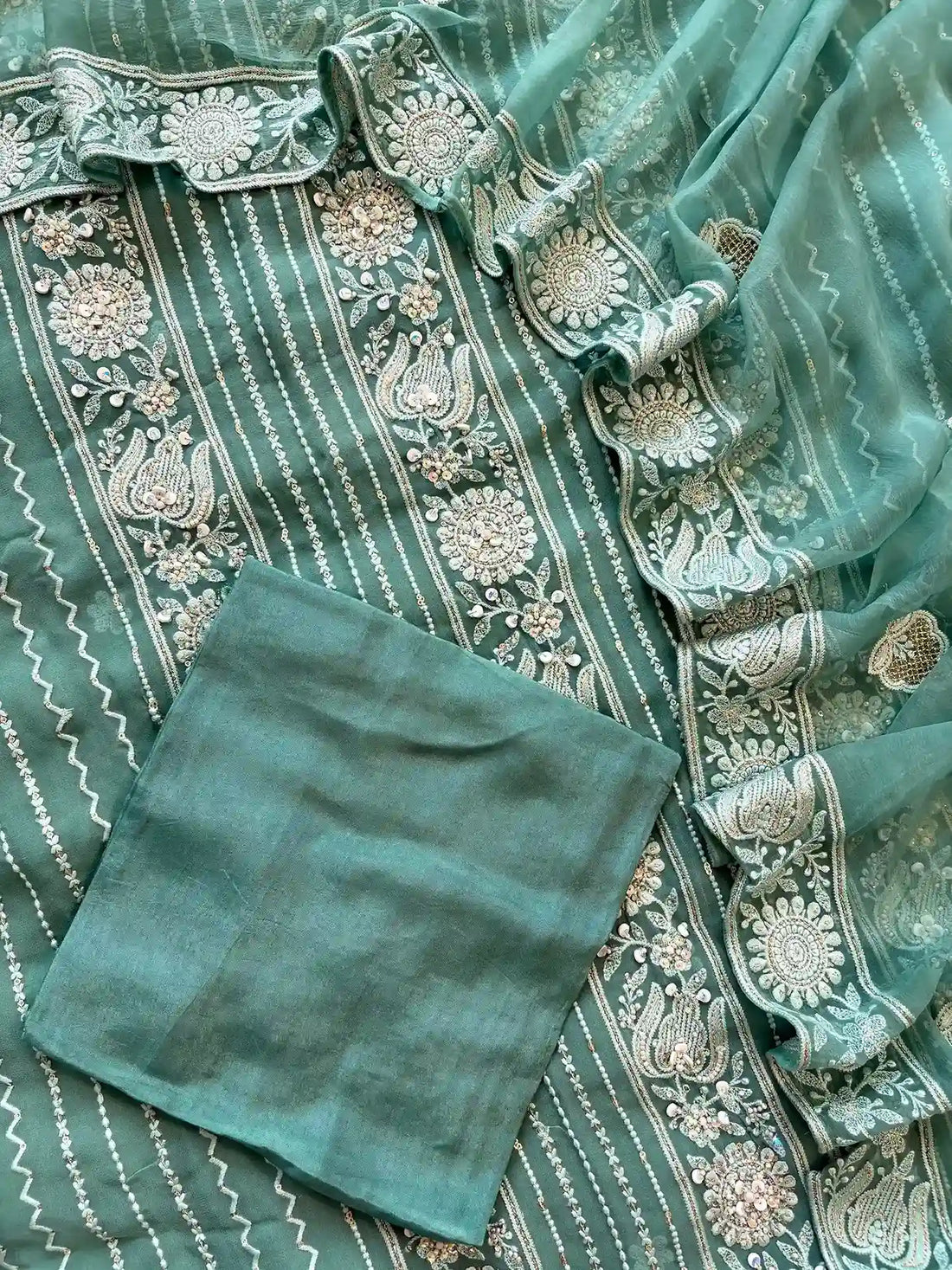 aqua green party wear chikankari unstiched suit with moti and sequence embellishments
