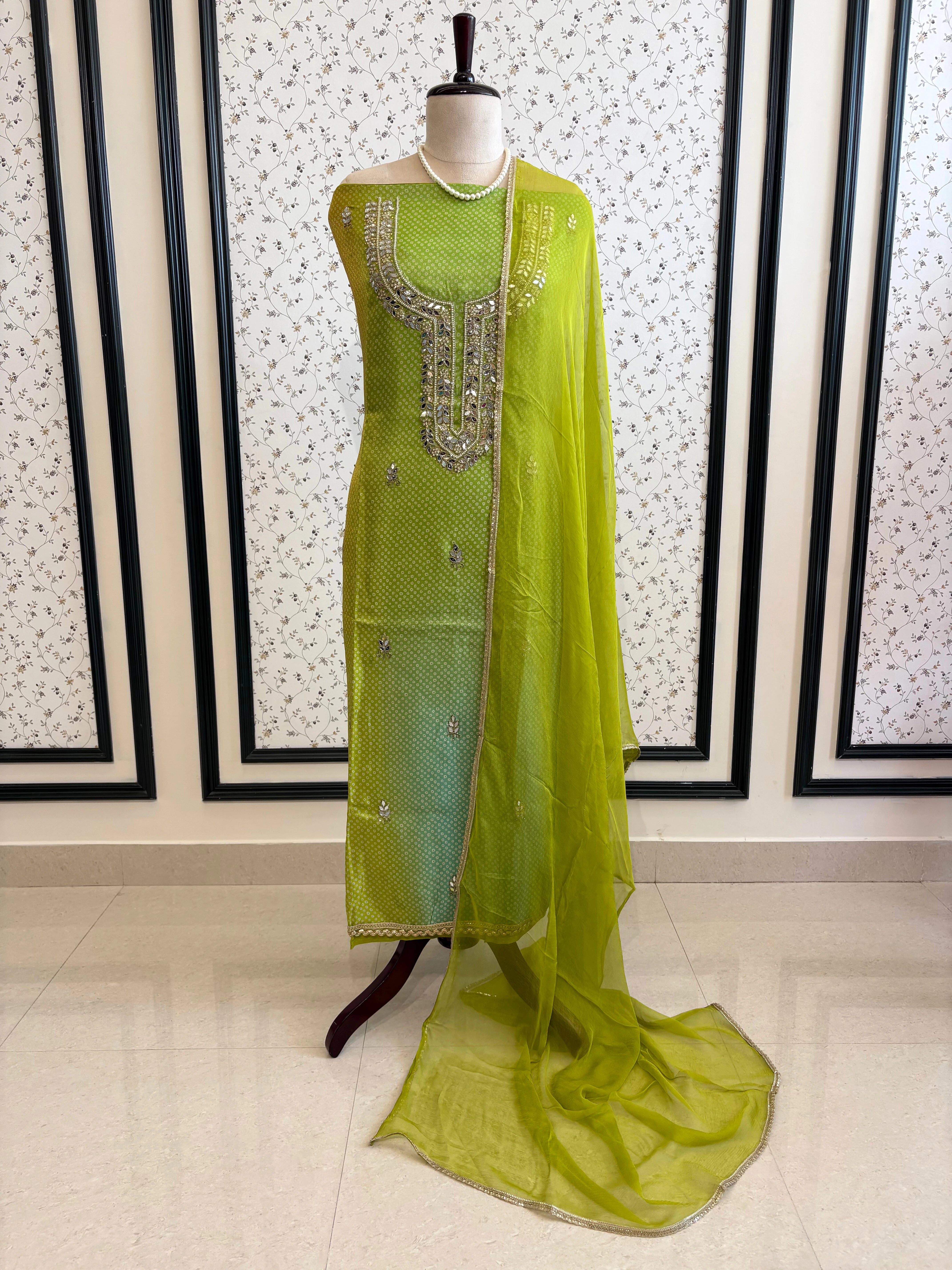 Lime Green Shimmer organza bandhani suit with ombre effect and chiffon dupatta with lace border.