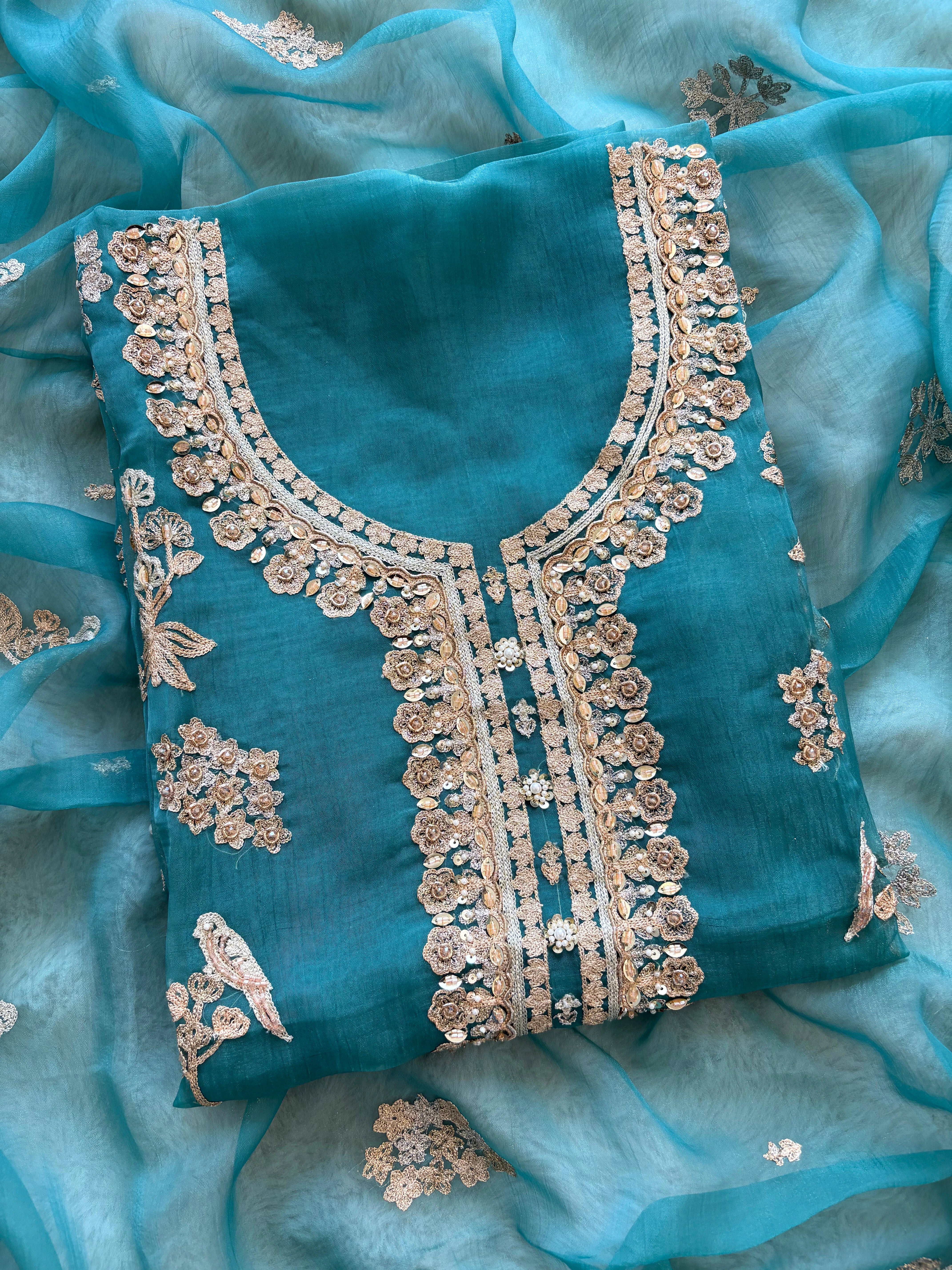 organza unstitched suit with zari work and parrot figure