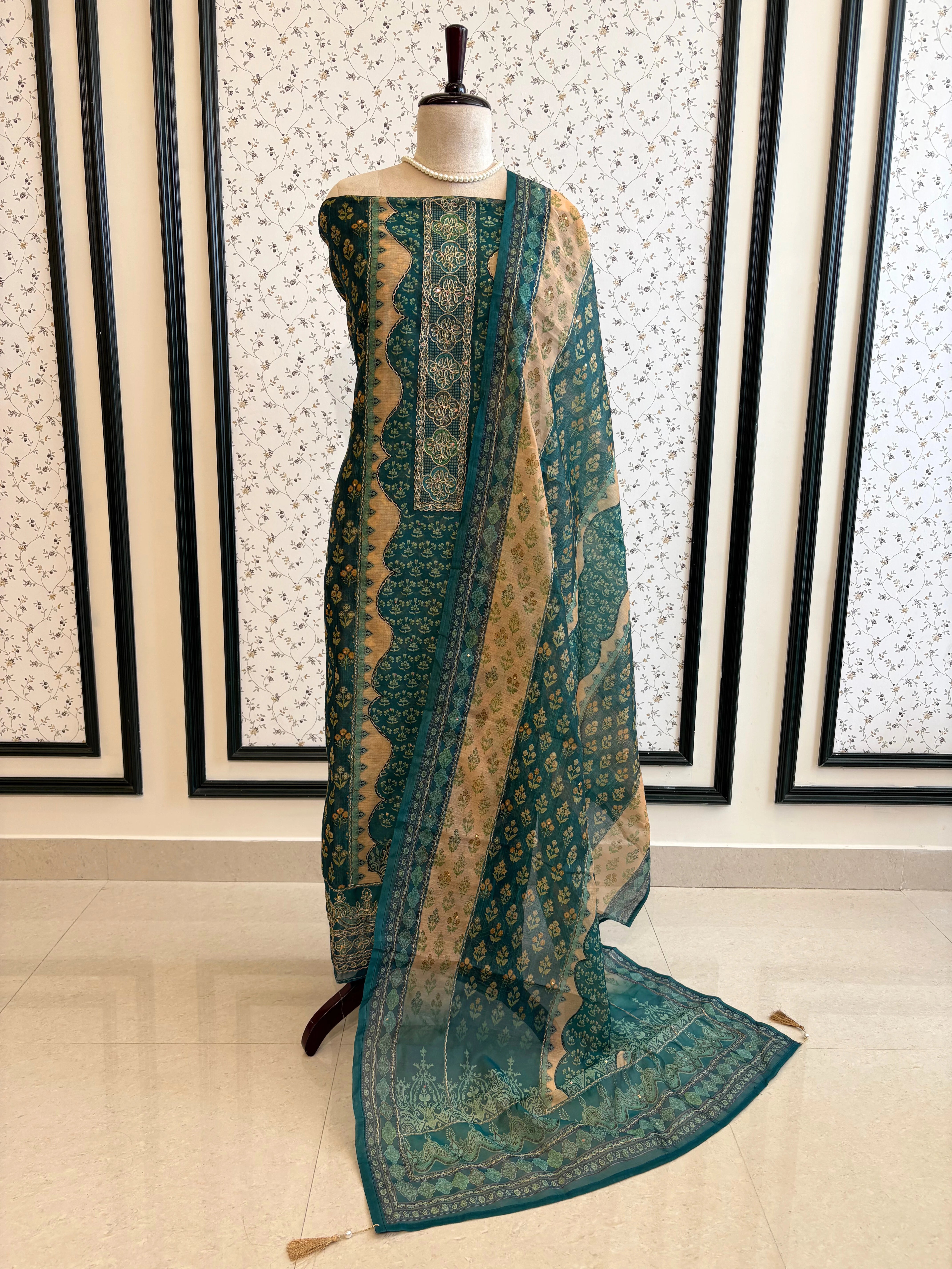 Teal green chanderi suit with golden weave and printed chanderi dupatta featuring tassel edging.