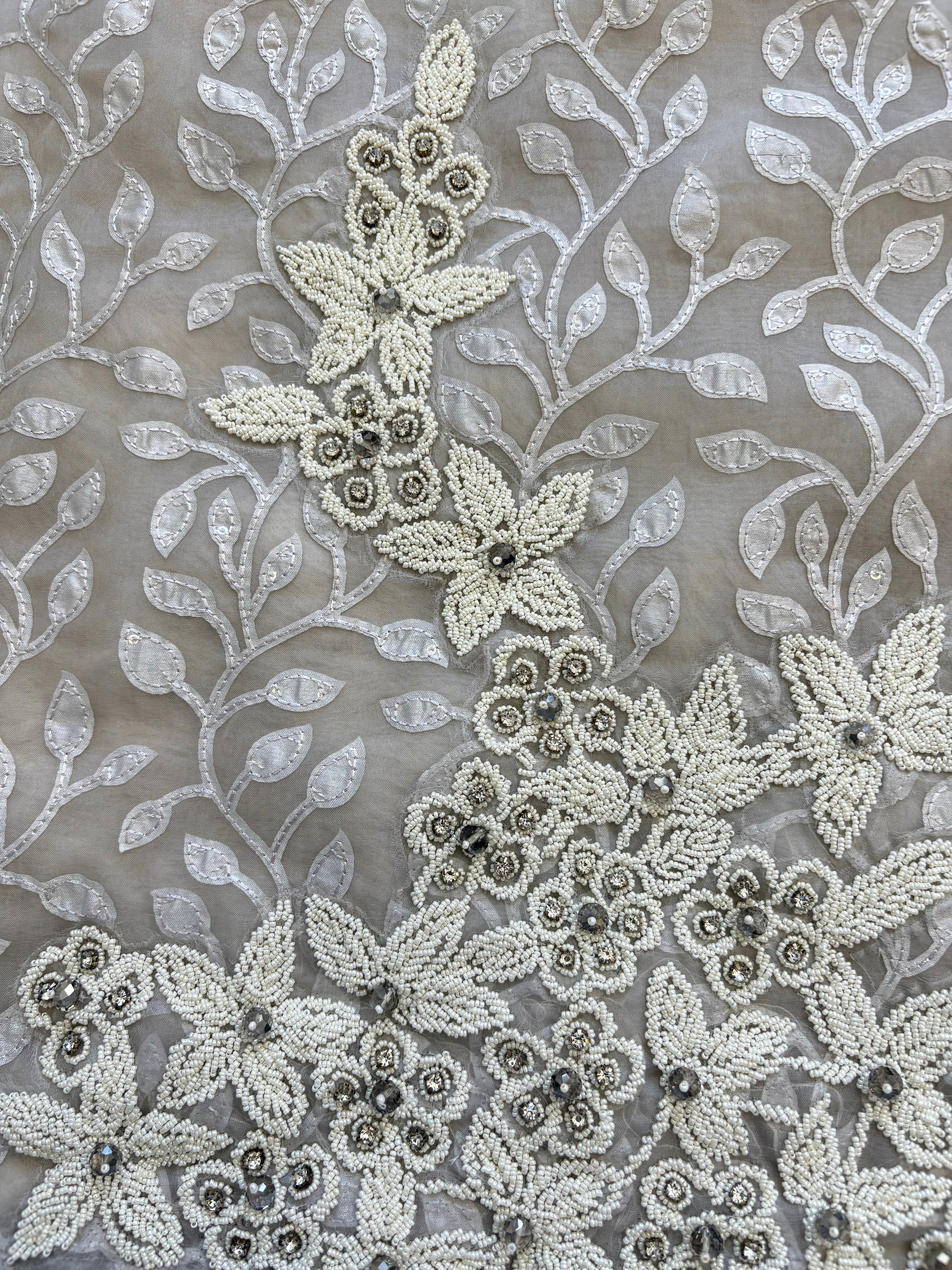 Silver grey organza suit with applique embroidery and moti bead embellishments, paired with embroidered organza dupatta.