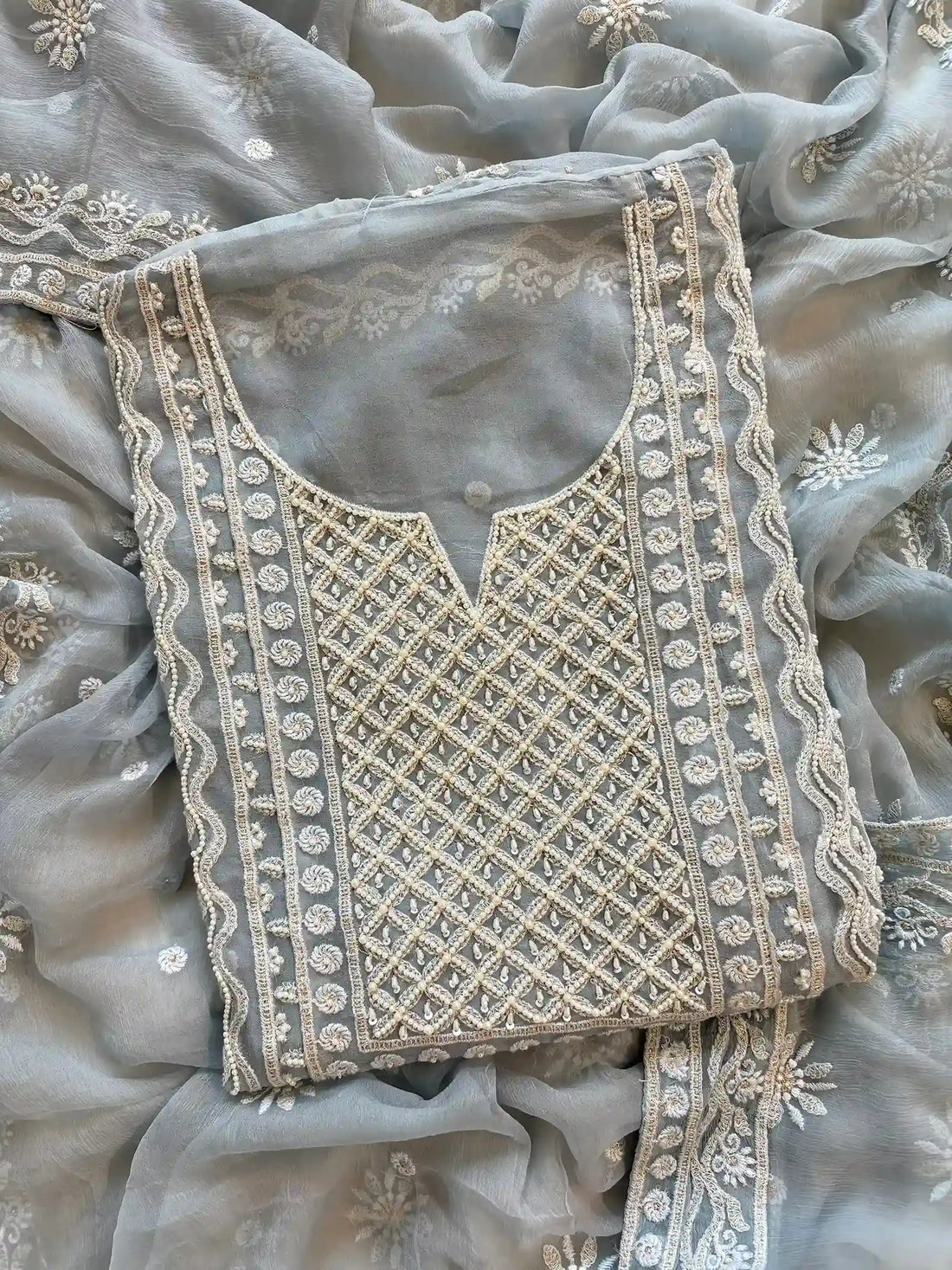 Powder blue georgette suit with moti highlighting and chiffon dupatta – embroidered festive ethnic wear for weddings and formal occasions.