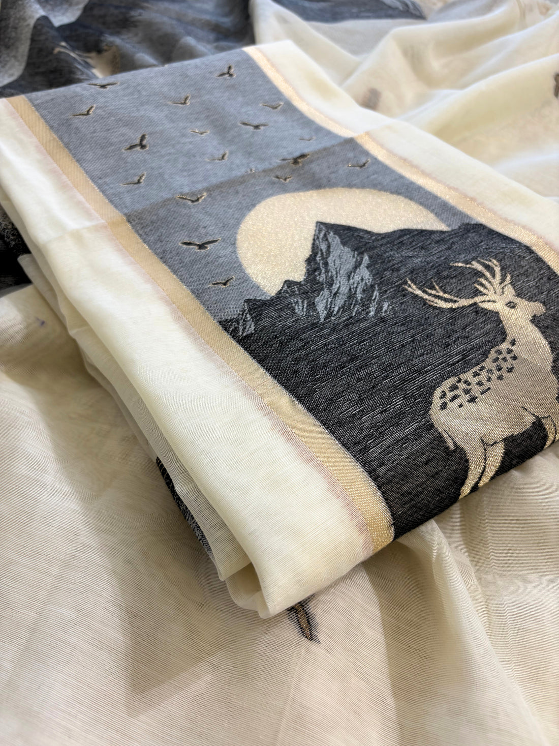 Grey and ivory Jamdaani suit with woven mountain, deer, and bird motifs, made with fine handloom weaving, perfect for winter and festive occasions.
