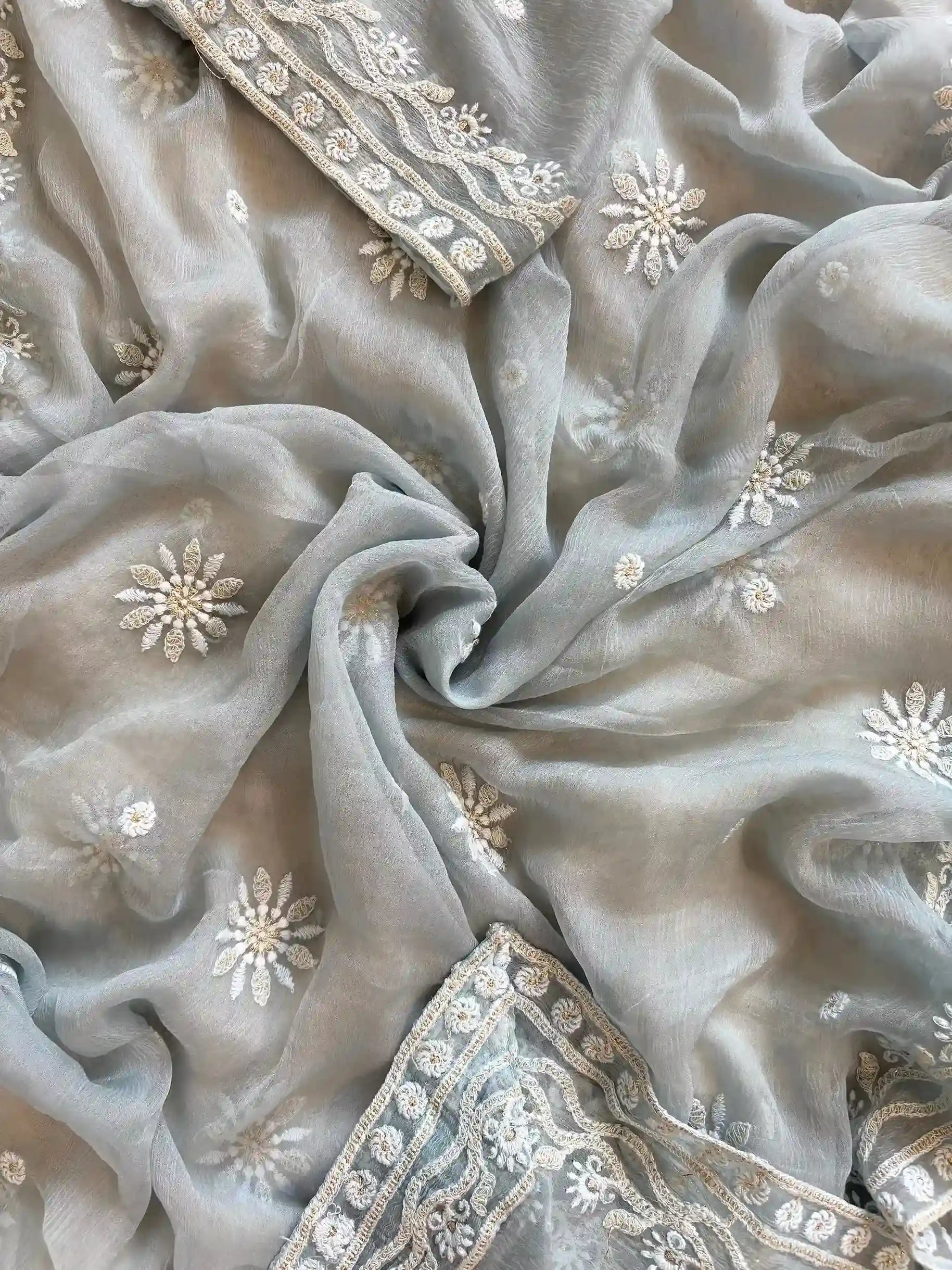 Powder blue georgette suit with moti highlighting and chiffon dupatta – embroidered festive ethnic wear for weddings and formal occasions.