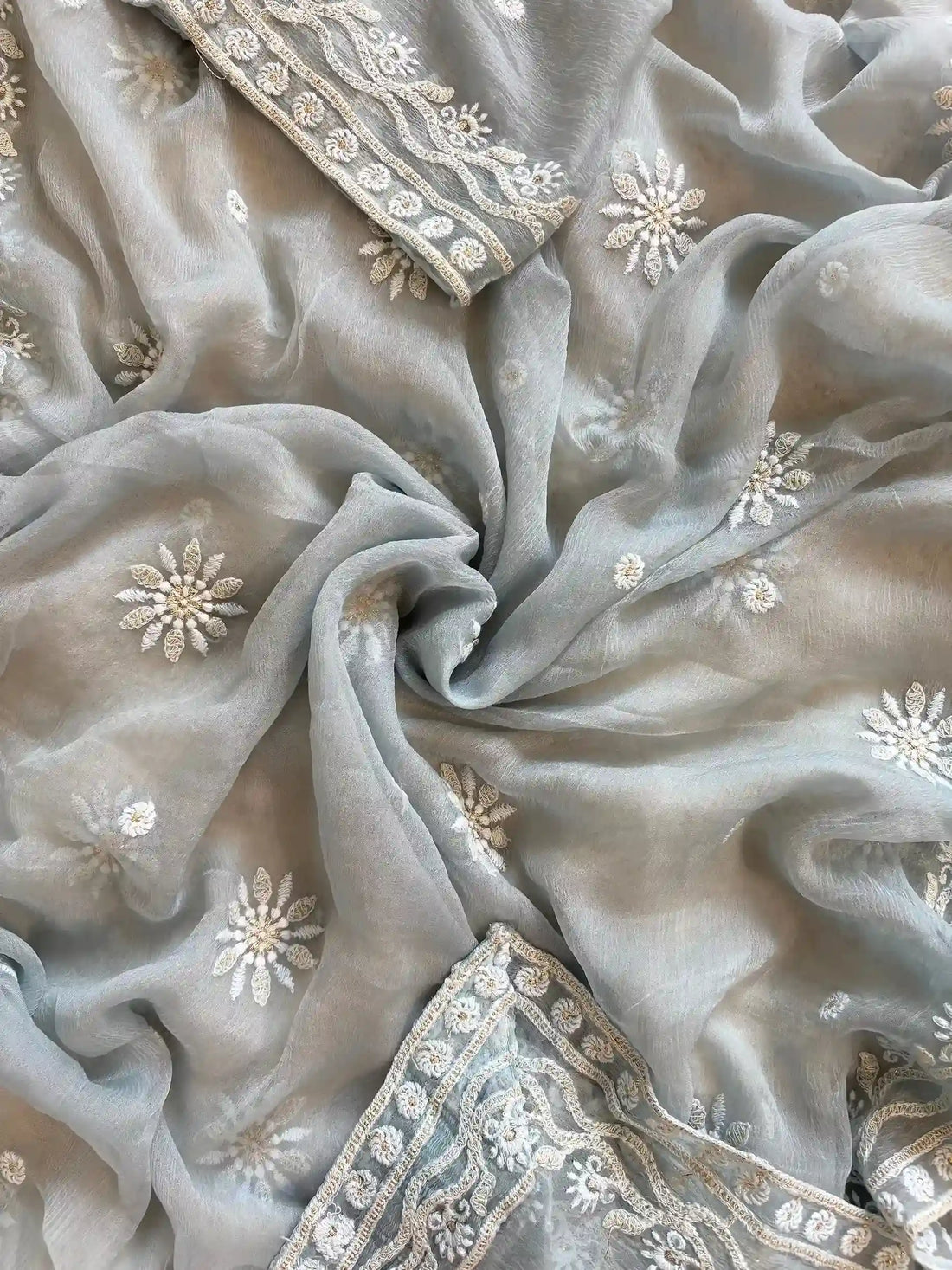 Powder blue georgette suit with moti highlighting and chiffon dupatta – embroidered festive ethnic wear for weddings and formal occasions.