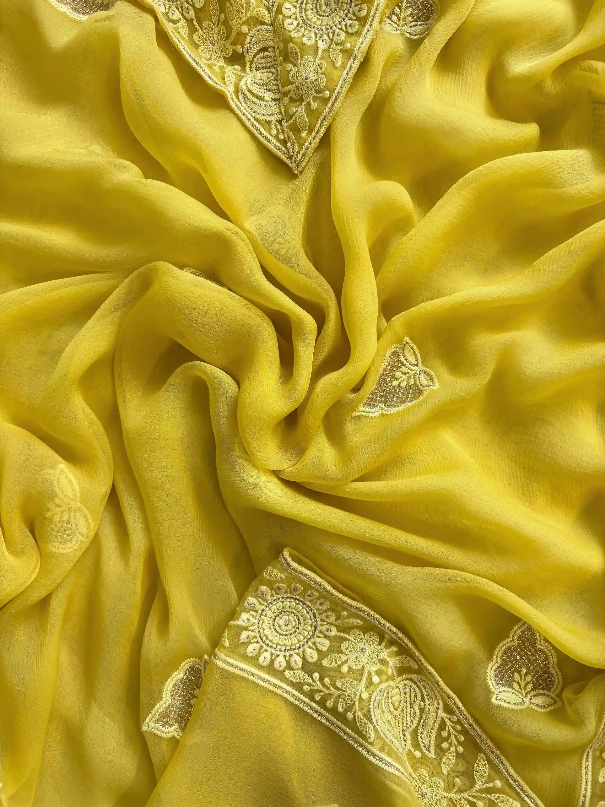 yellow georgette chikankari unstitched suit with moti and sequence embellishments