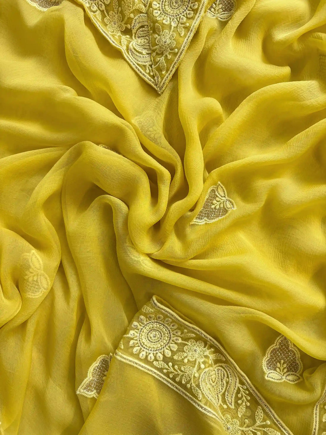 yellow georgette chikankari unstitched suit with moti and sequence embellishments