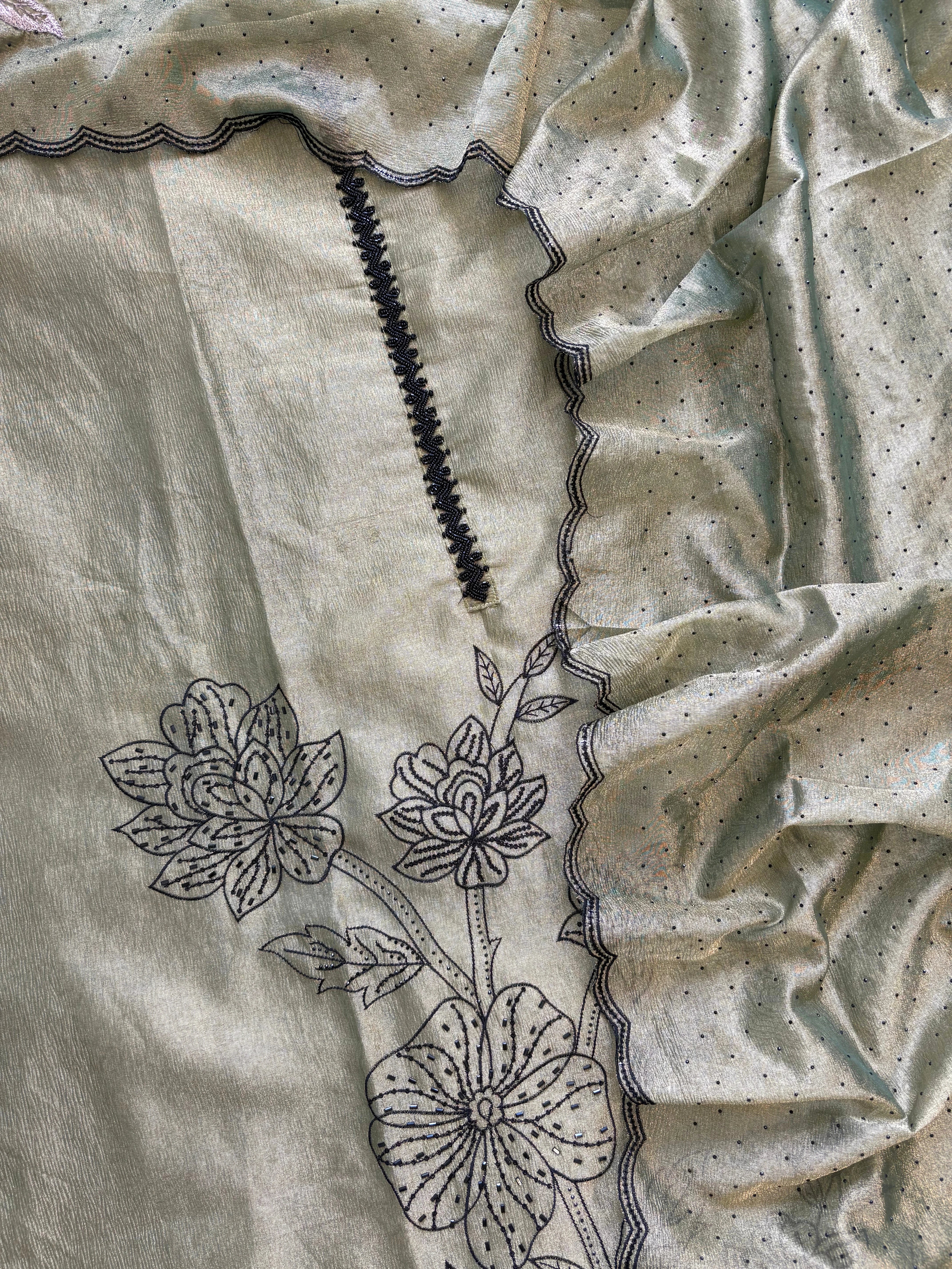 Olive green glass tissue suit with intricate embroidery and organza dupatta – luxury ethnic wear for weddings and festive occasions.