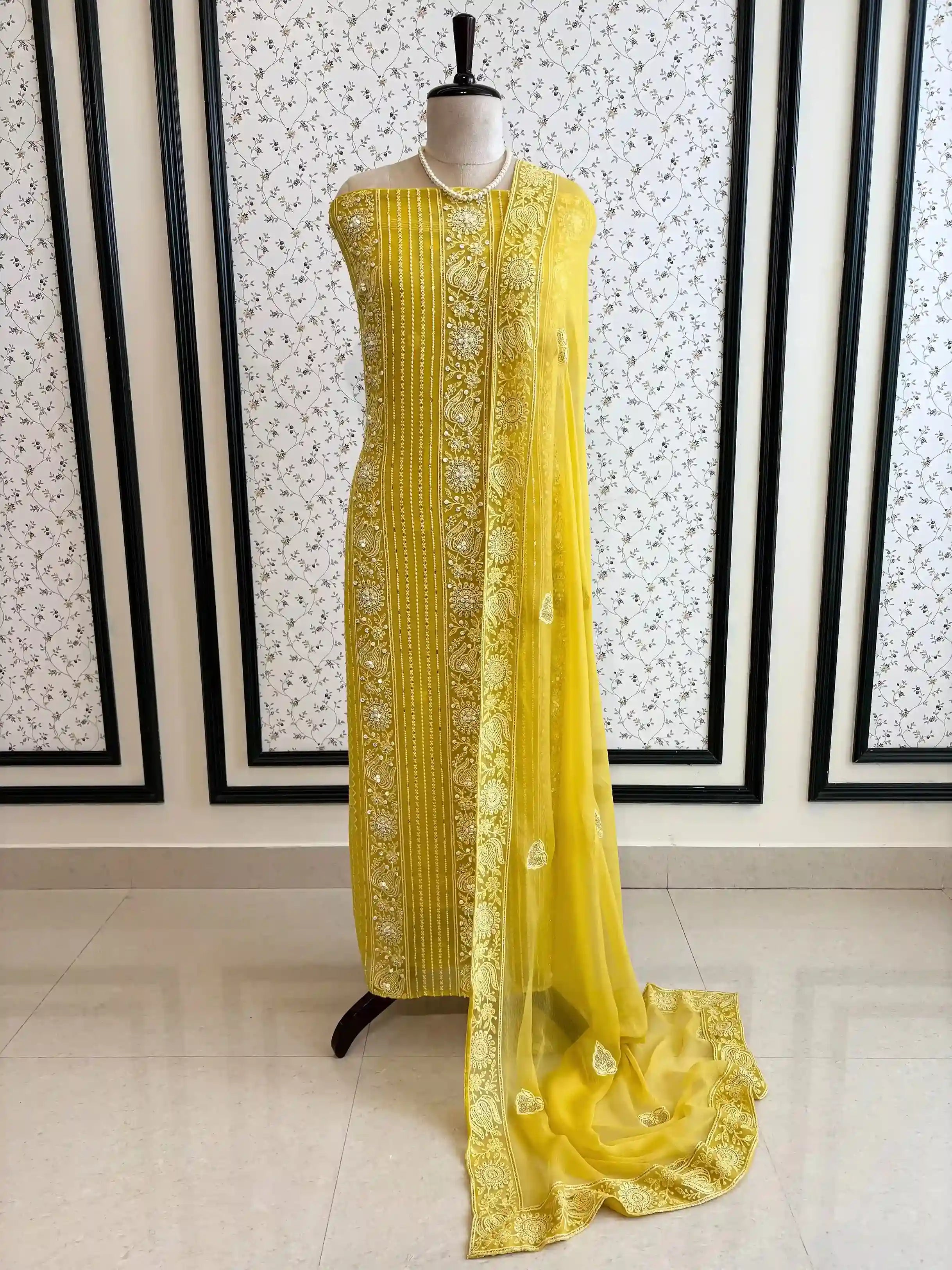 yellow georgette chikankari unstitched suit with moti and sequence embellishments
