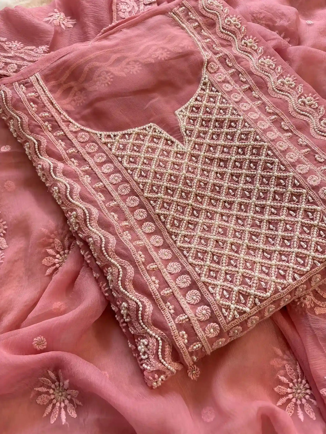 Powder pink georgette suit with moti highlighting and chiffon dupatta – embroidered festive ethnic wear for weddings and formal occasions.