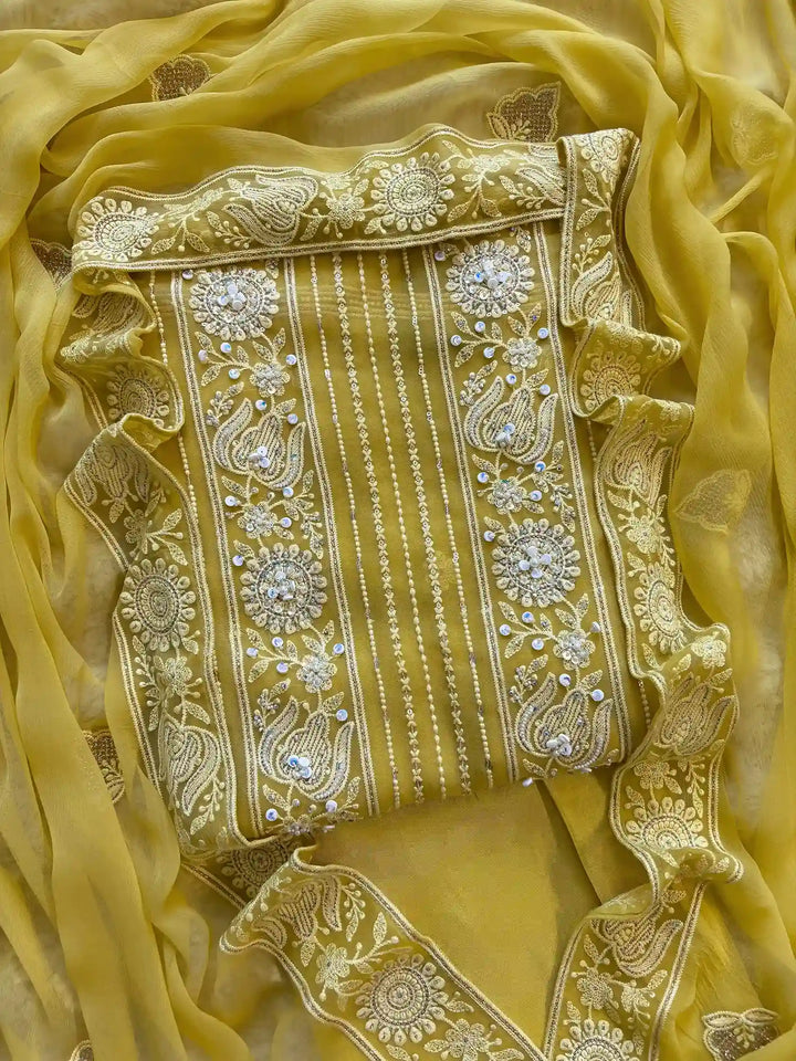 yellow georgette chikankari unstitched suit with moti and sequence embellishments