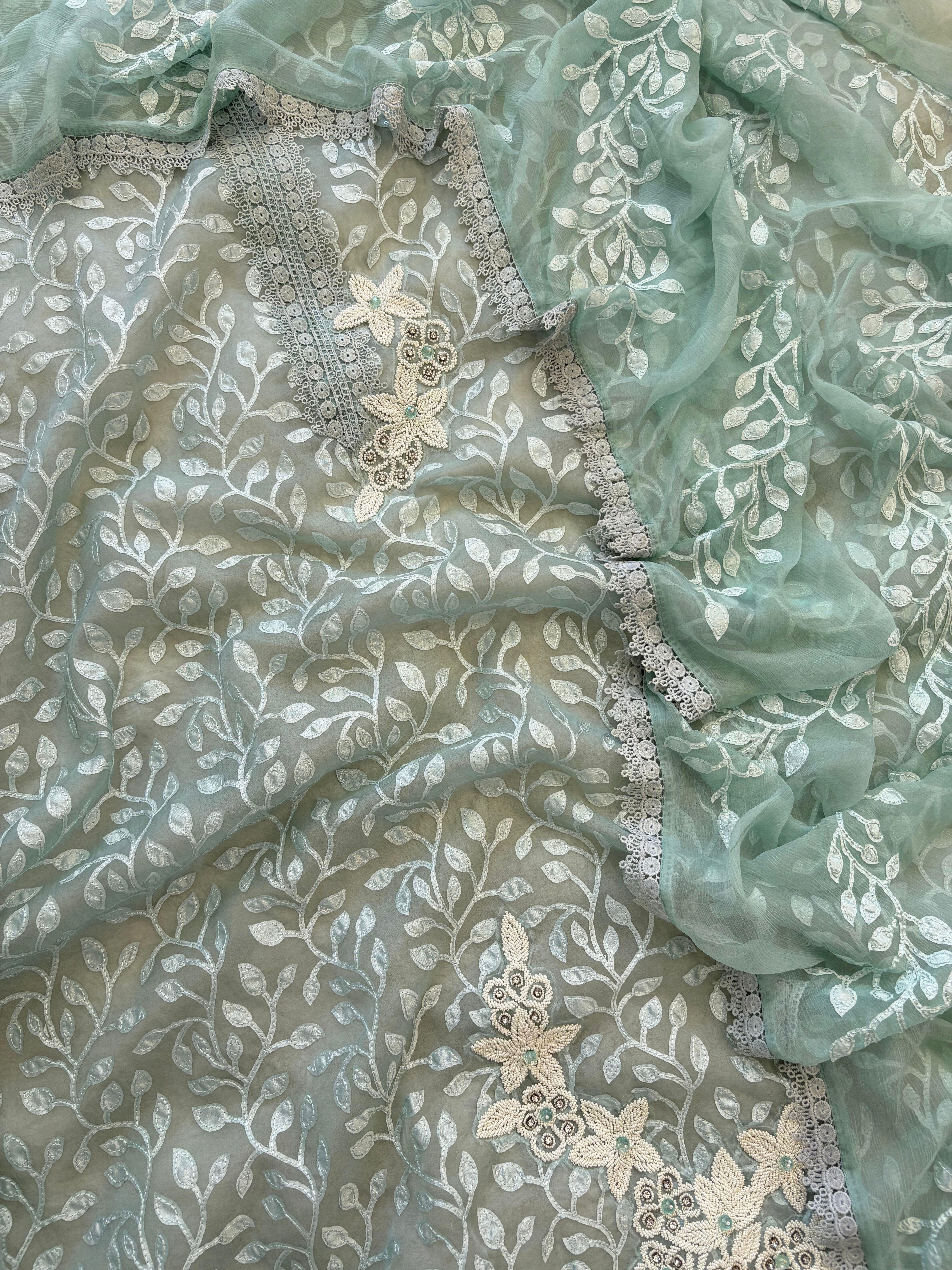 Pastel Green suit with applique embroidery and moti bead embellishments, paired with embroidered organza dupatta.