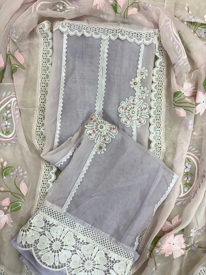 Lavender organza unstitched suit with white lace embroidery, cutwork border, and pastel floral printed organza dupatta – festive summer ethnic wear