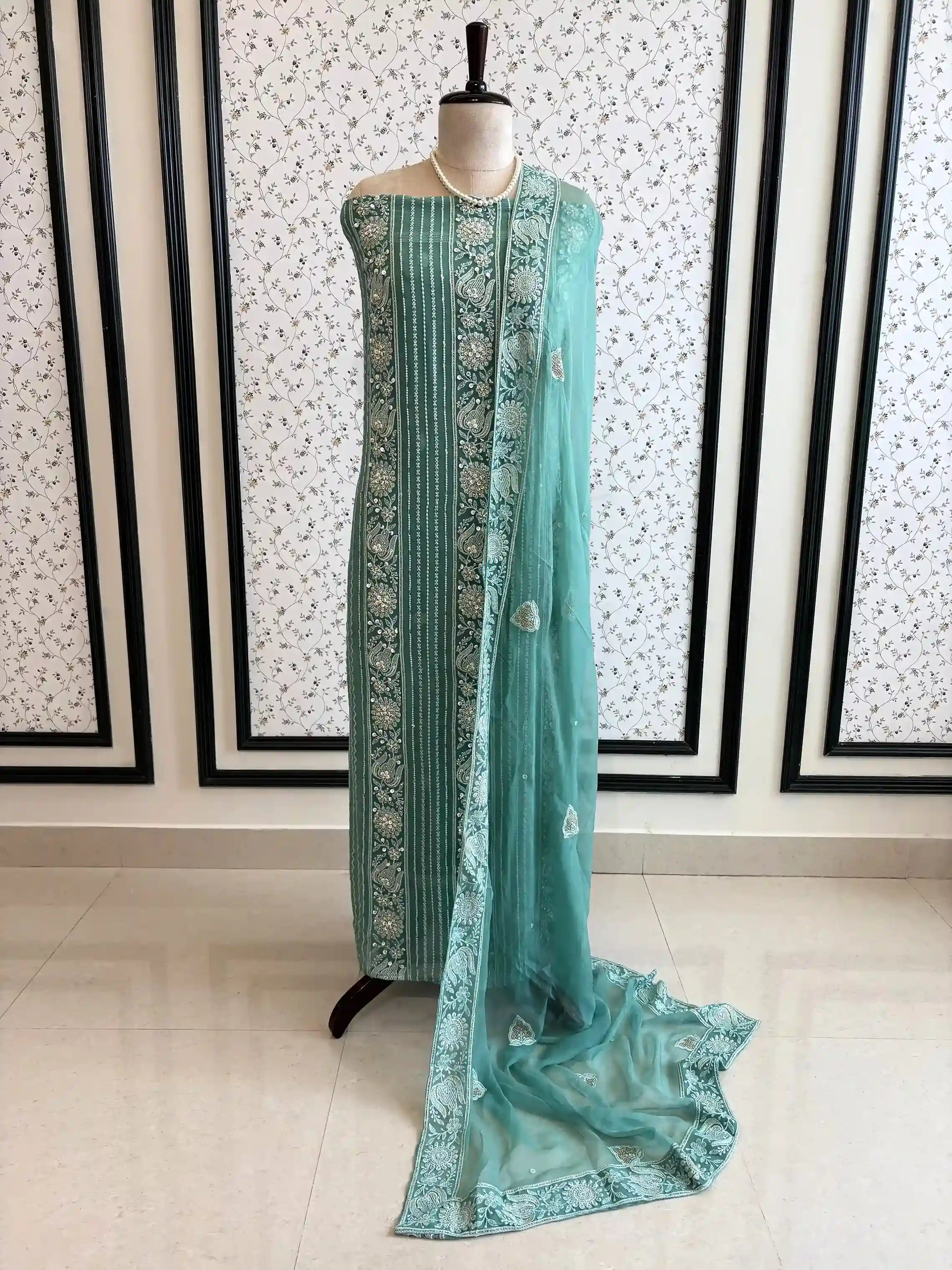 aqua green party wear chikankari unstiched suit with moti and sequence embellishments