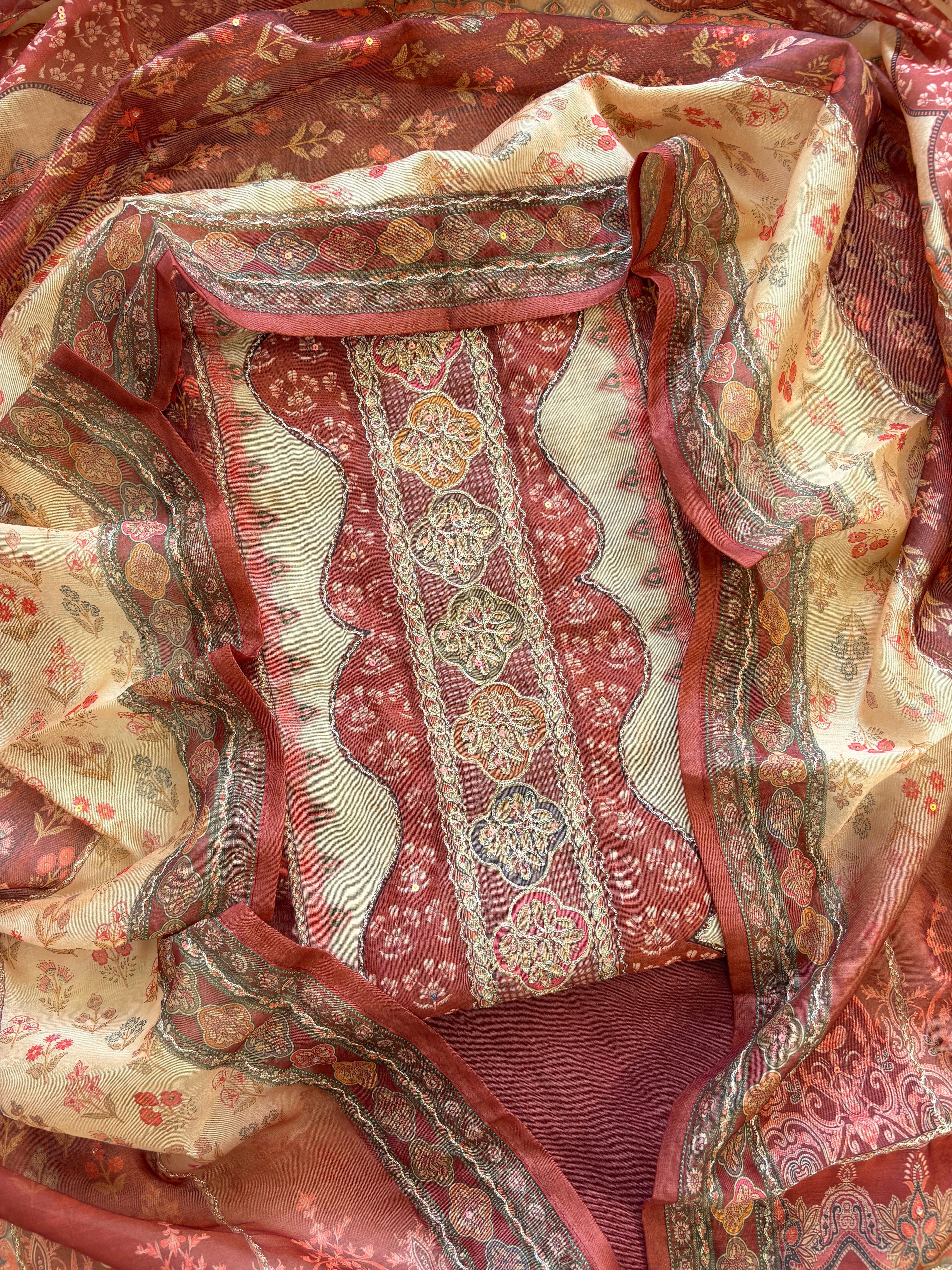 Rust red chanderi suit with golden weave and printed chanderi dupatta featuring tassel edging.