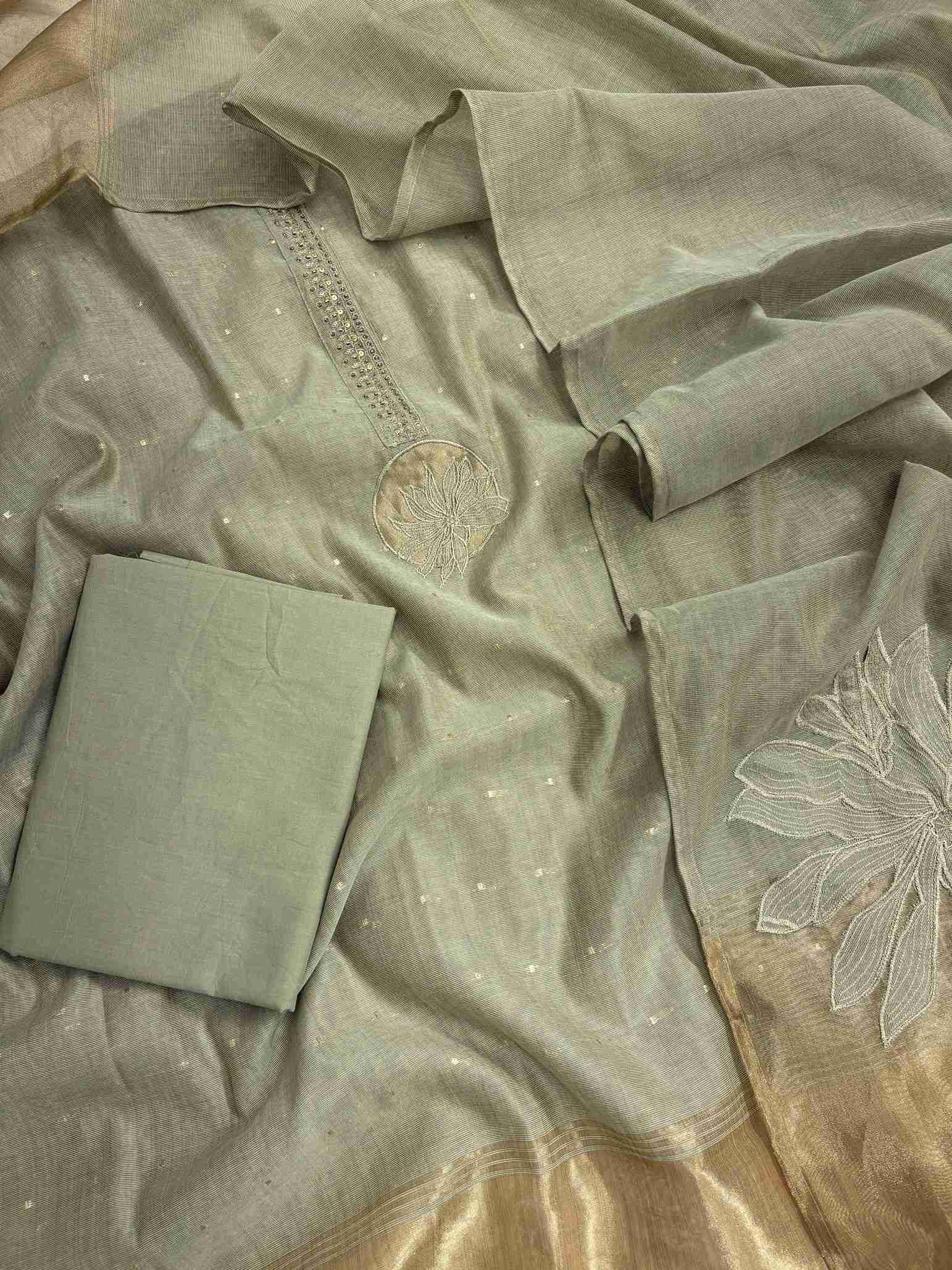 Sage Green Jamdani Cotton Unstitched Suit | Minimalist Applique Floral Neckline | Broad Gold Zari Patta Hemline & Applique Corner Dupatta Women's Suit