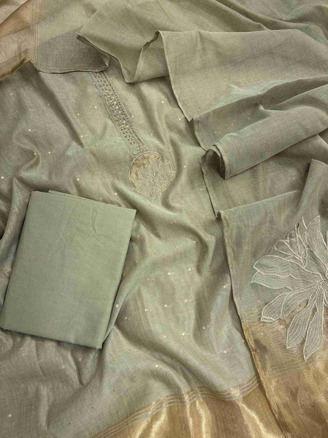 Sage Green Jamdani Cotton Unstitched Suit | Minimalist Applique Floral Neckline | Broad Gold Zari Patta Hemline & Applique Corner Dupatta Women's Suit