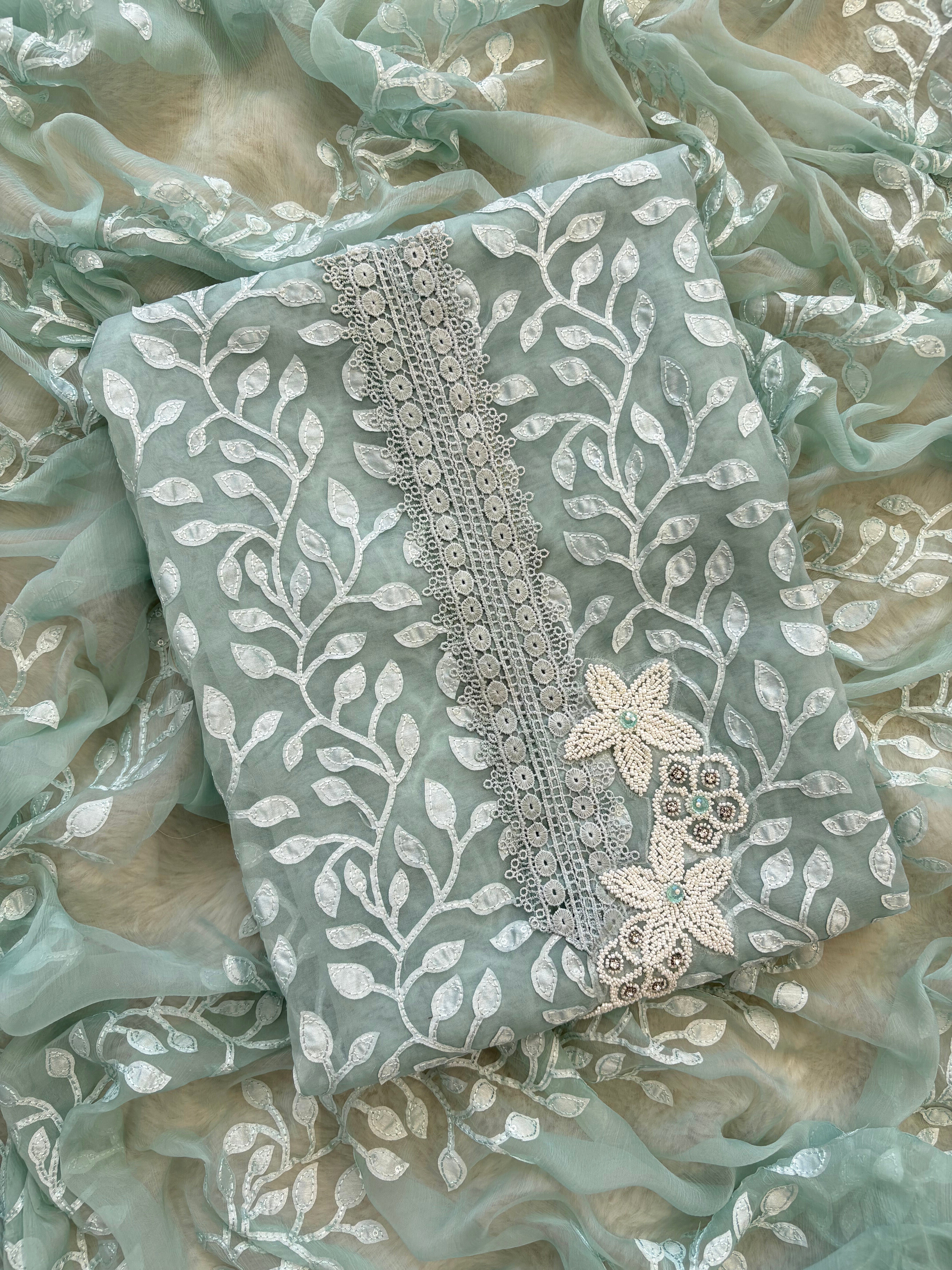 Pastel Green suit with applique embroidery and moti bead embellishments, paired with embroidered organza dupatta.